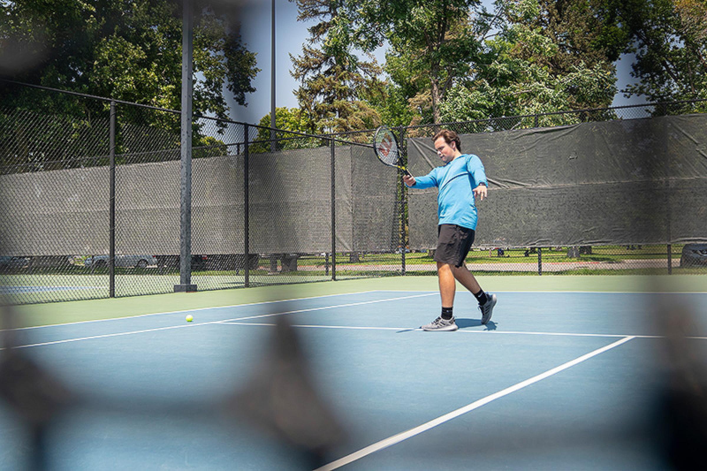 Person playing tennis