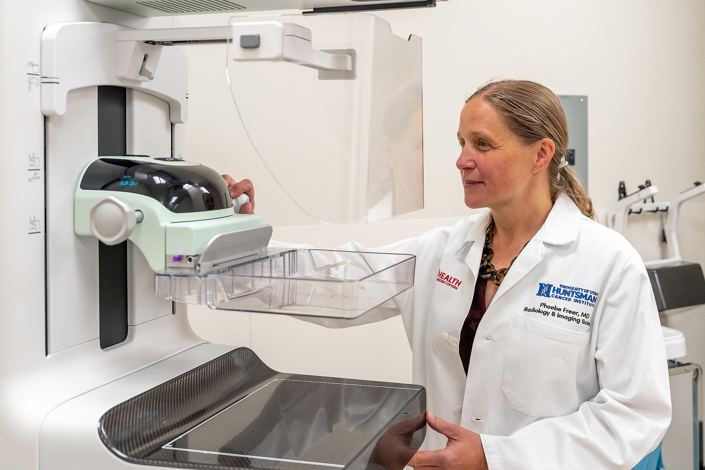 Phoebe Freer, MD, adjusting a mammography machine