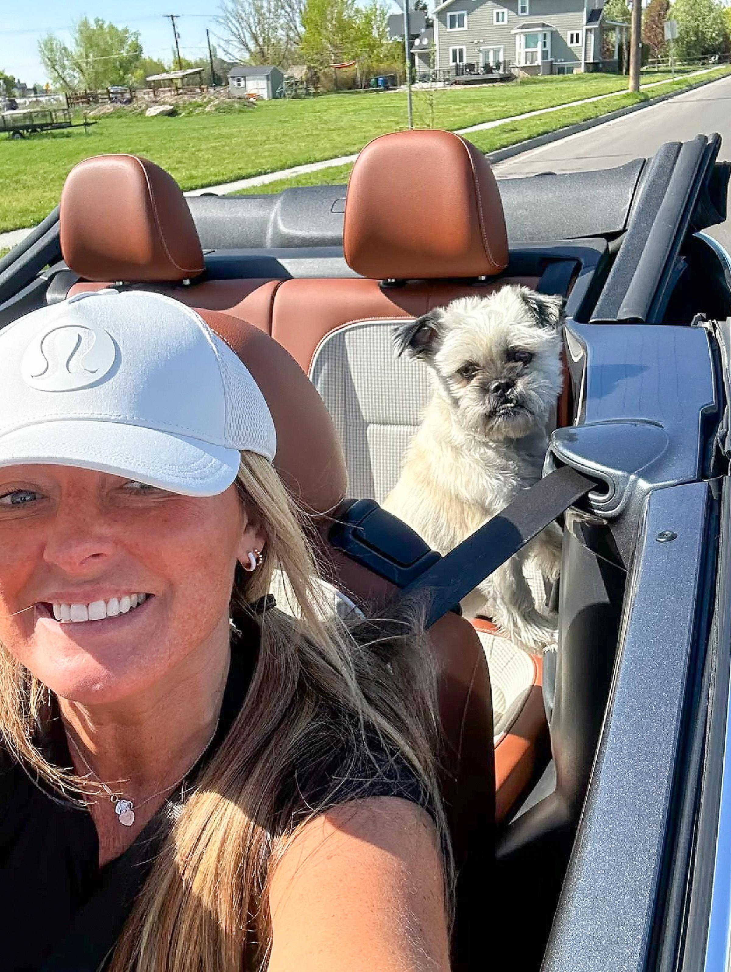 Amber letting her hair blow in the wind in her new Volkswagen Beetle