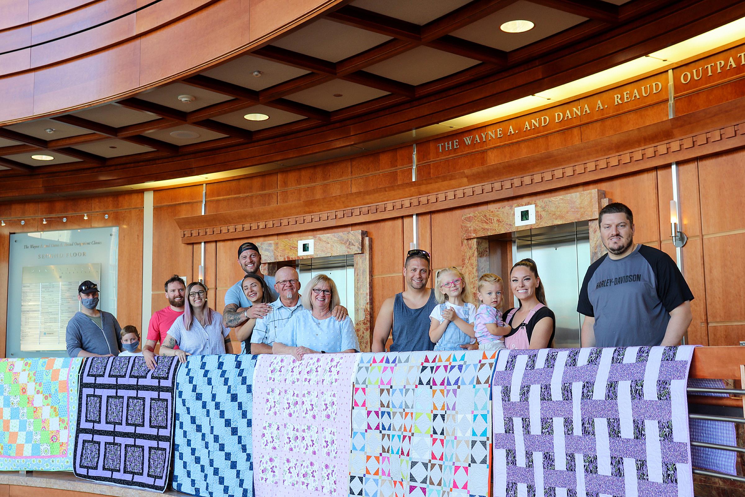 Natalie's family with quilts