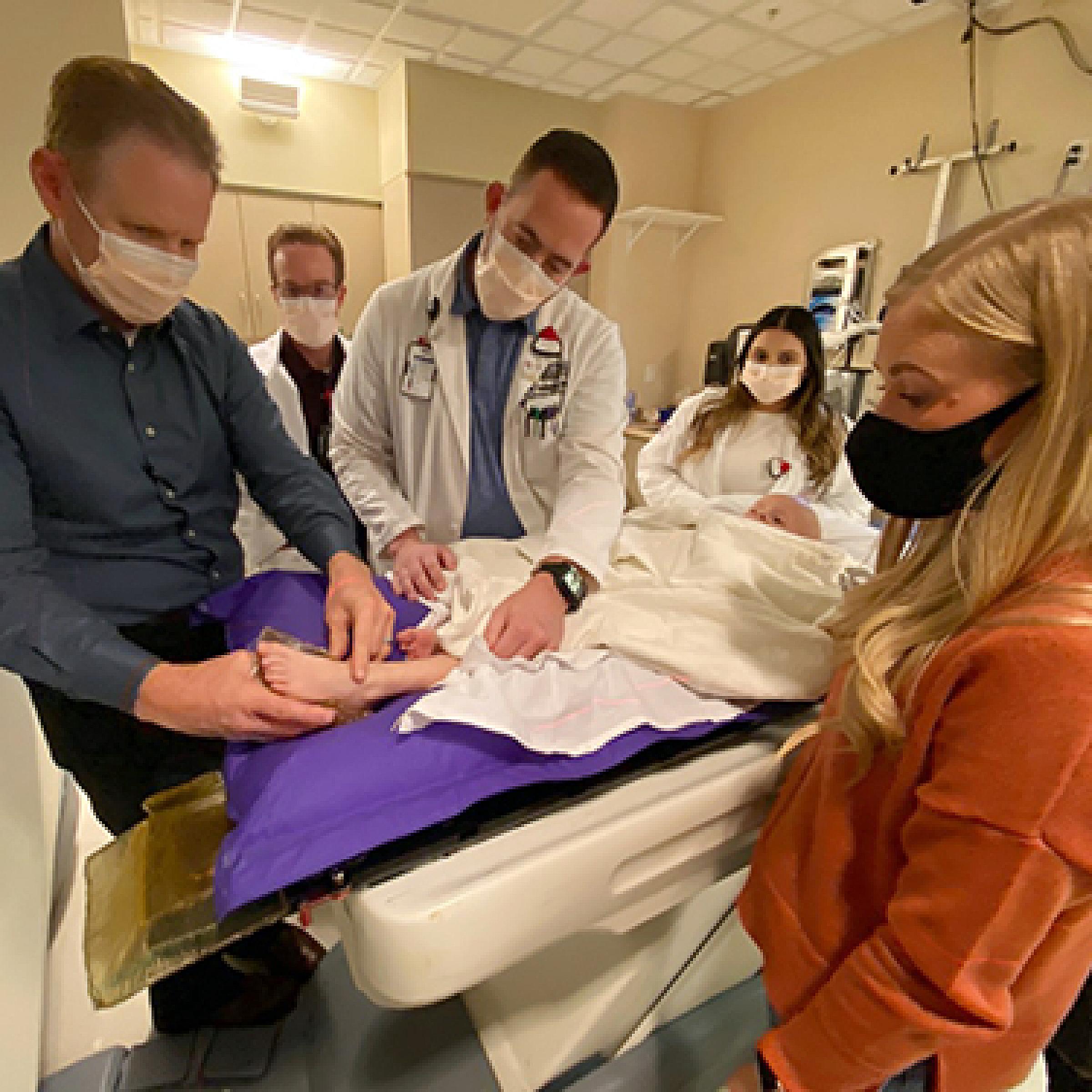 Dr. Matthew Poppe and Radiation Oncology staff with Marshall and his mom, Ashley