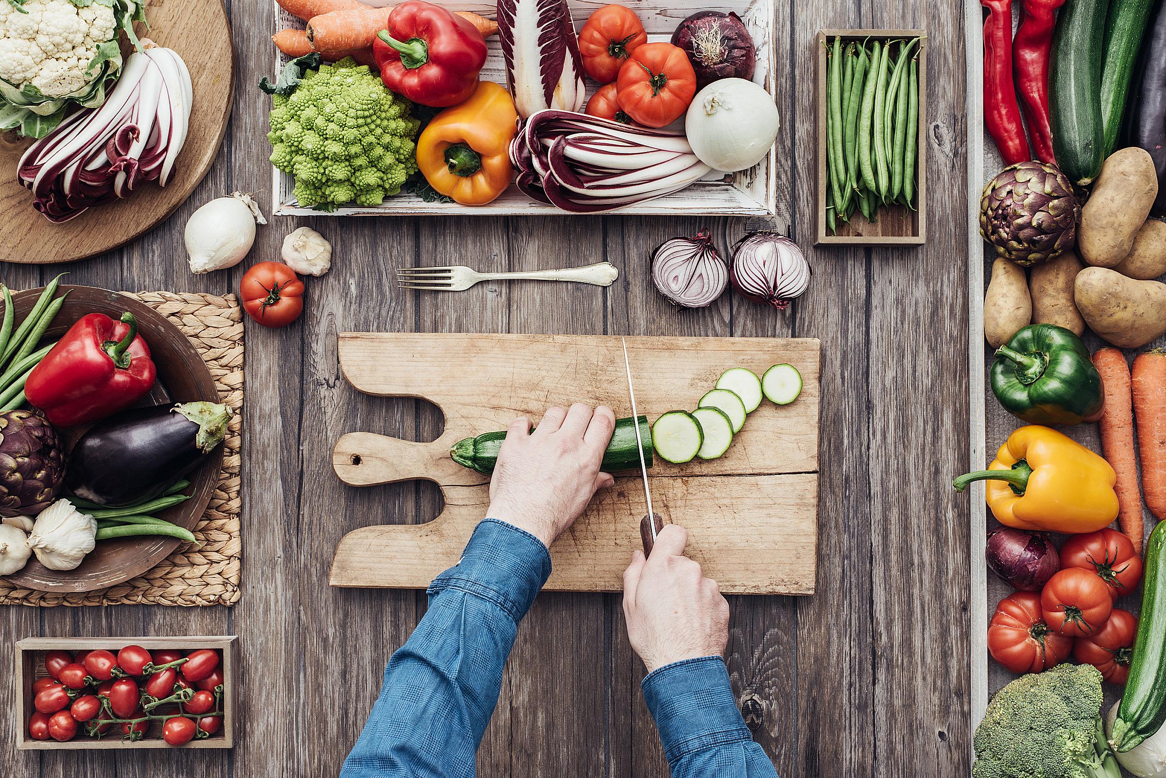 Top down view of person chopping vegetables