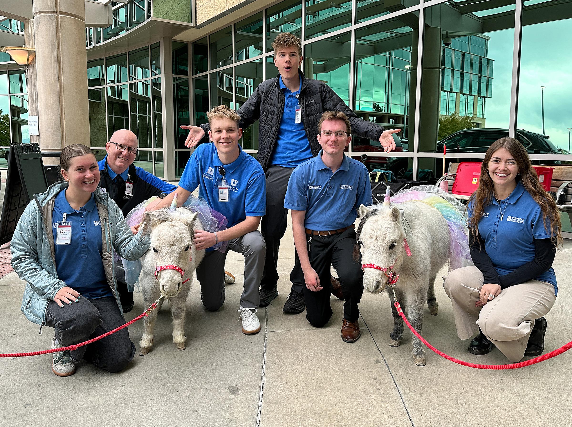 Chris Moss (second from the left) with the therapy horses and their volunteers