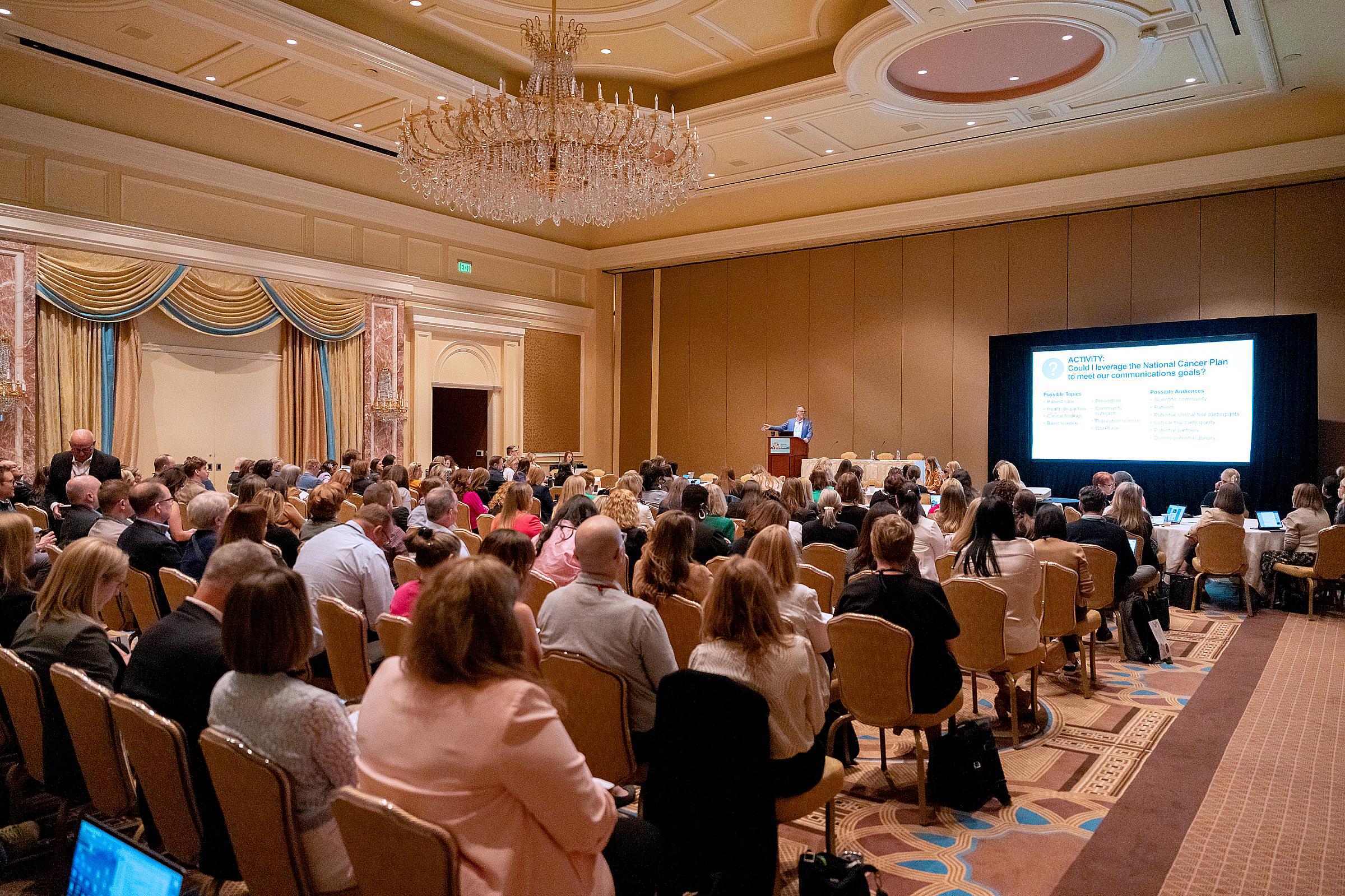 Conference attendees participating in a session on industry best practices