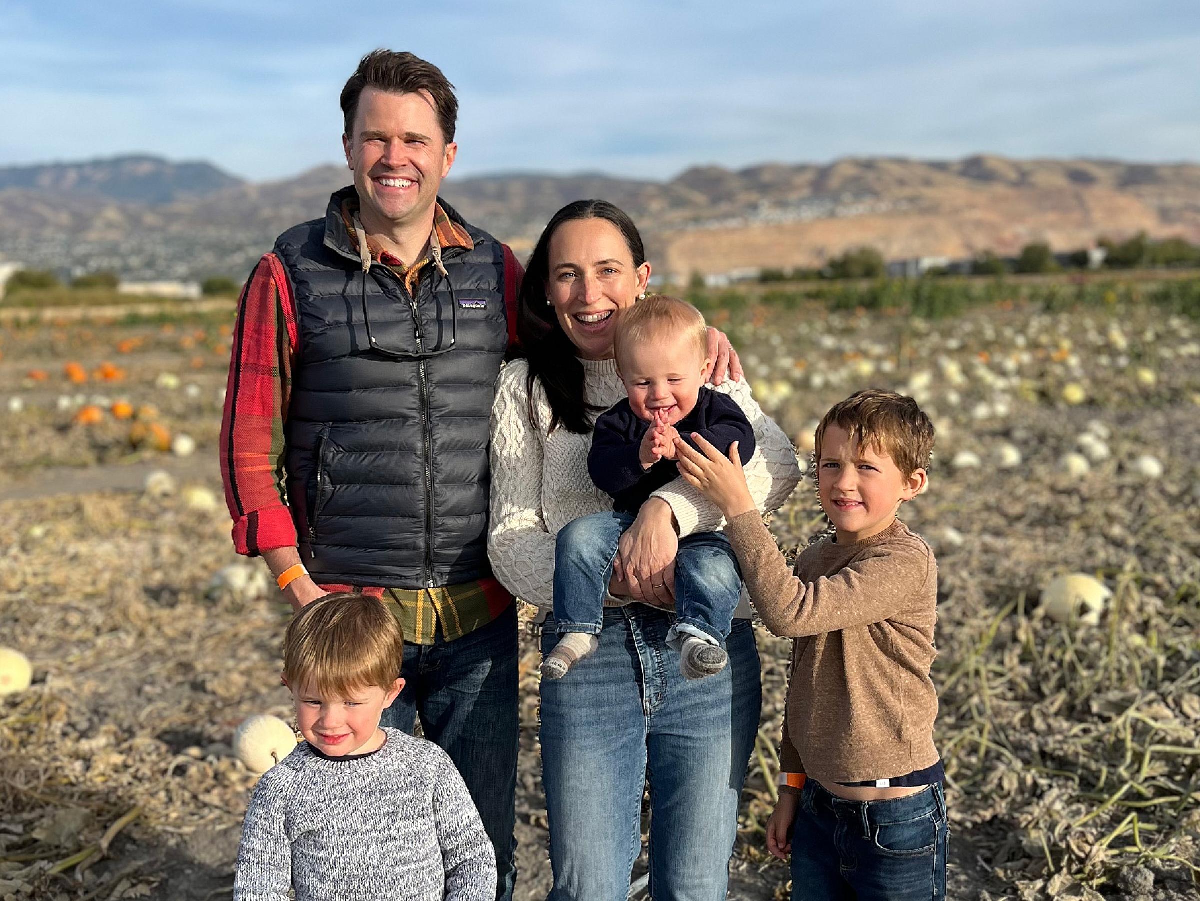 Doug Fair and his family in a pumpkin patch