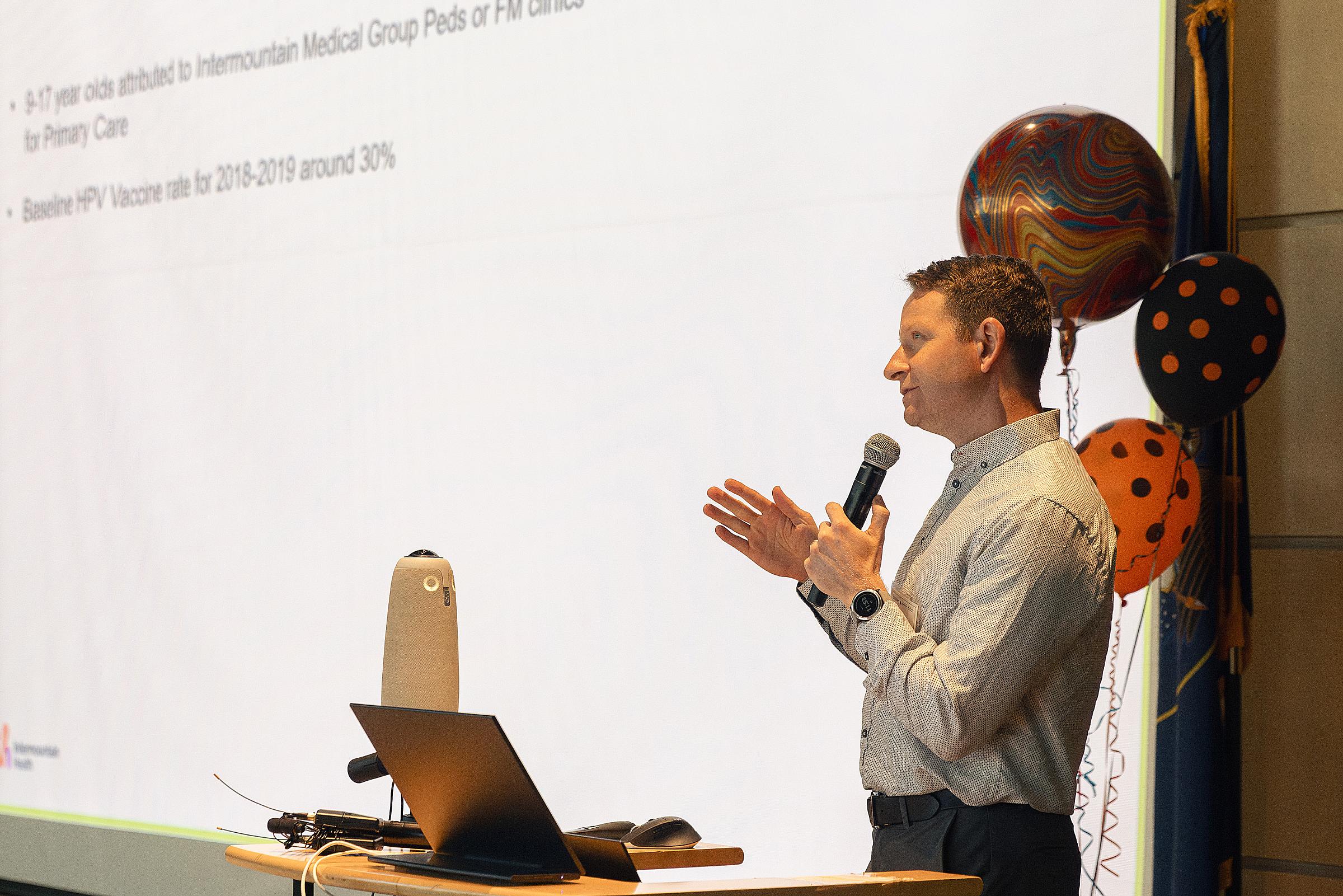 Engaging the participants in thoughtful lecture, R. Neal Davis, MD reflects on HPV vaccination acceptance in Intermountain Health patients.