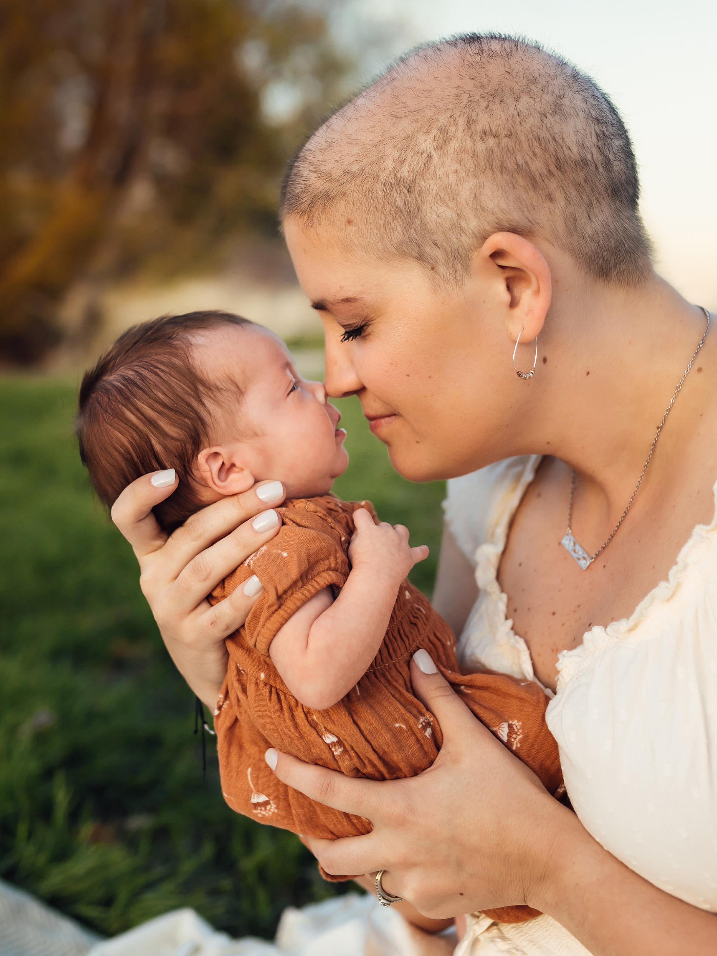 Kaci Popp holder her newborn baby, Allison