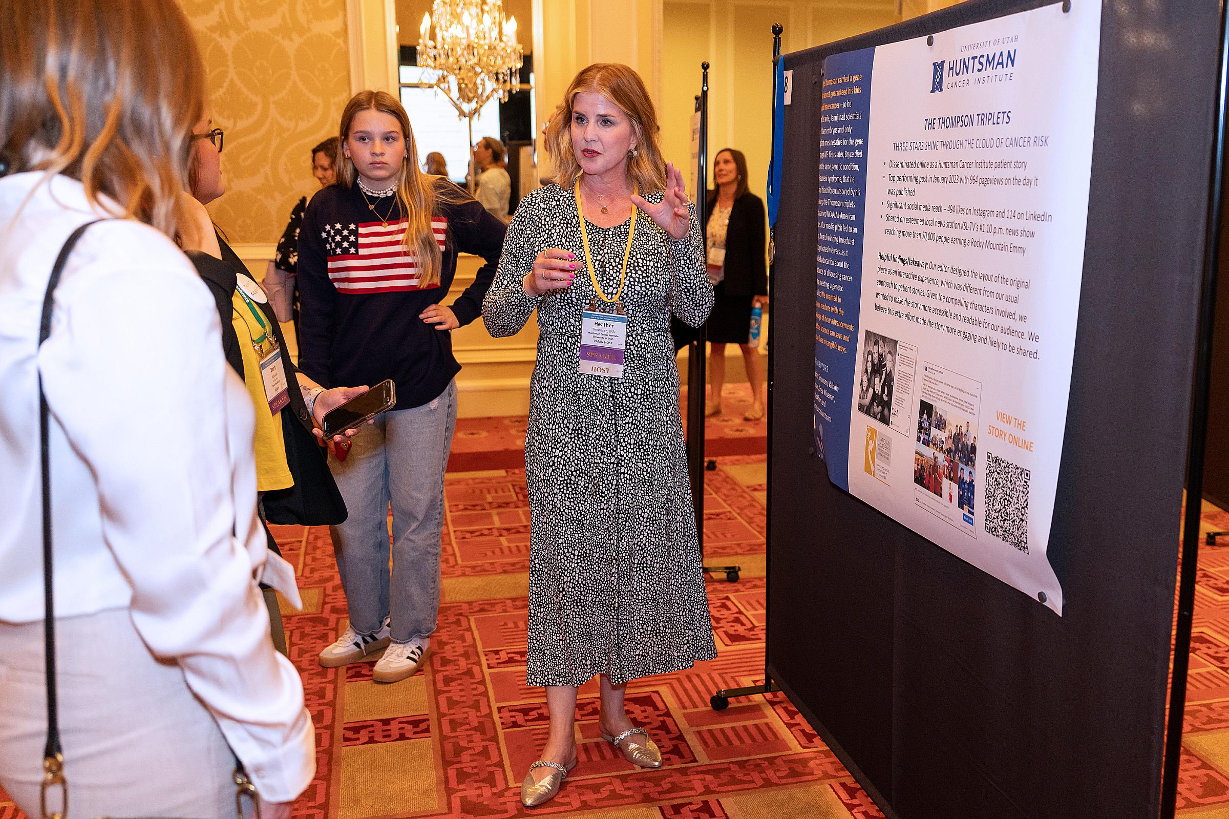 Heather Simonsen answering questions about a poster