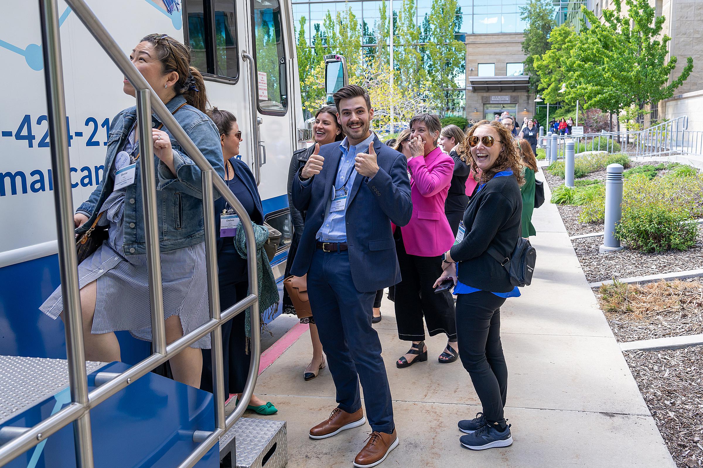Tour group entering the mobile cancer screening and education bus