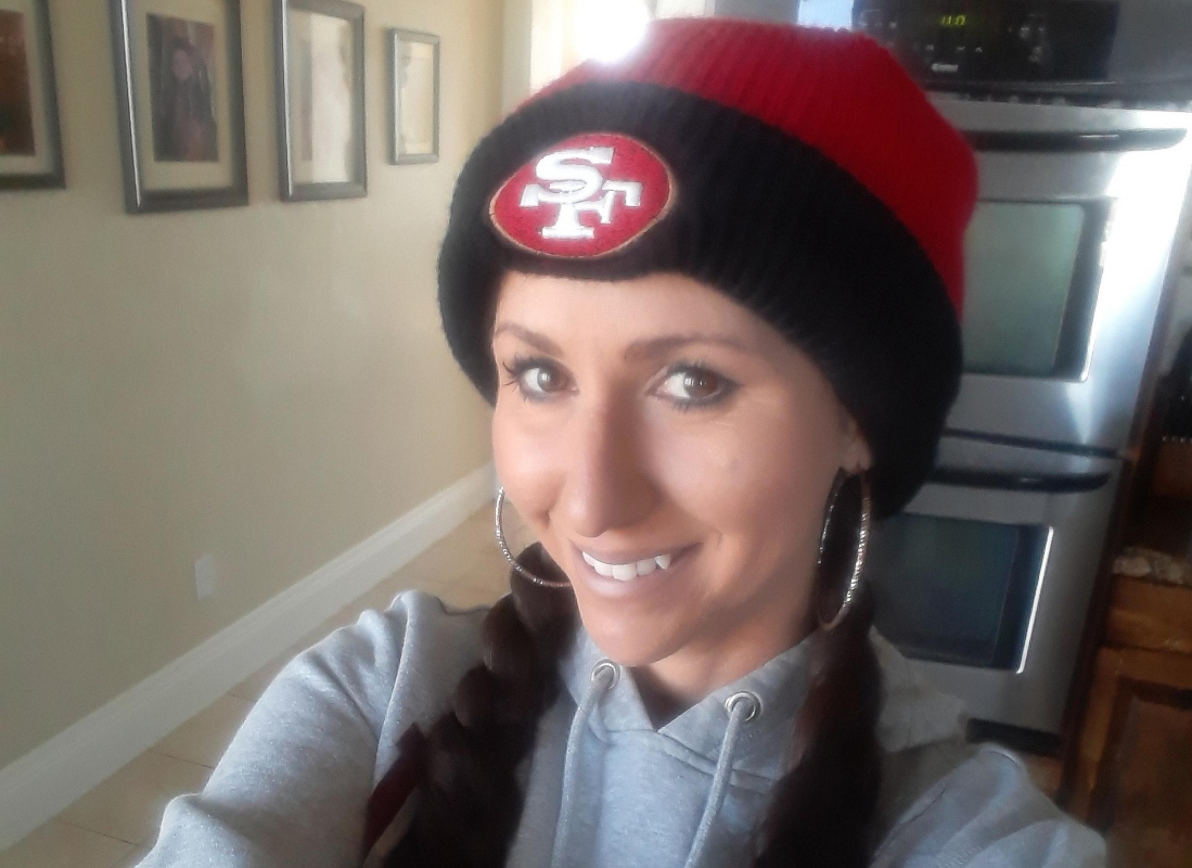 Renee Bustos at home with sports beanie