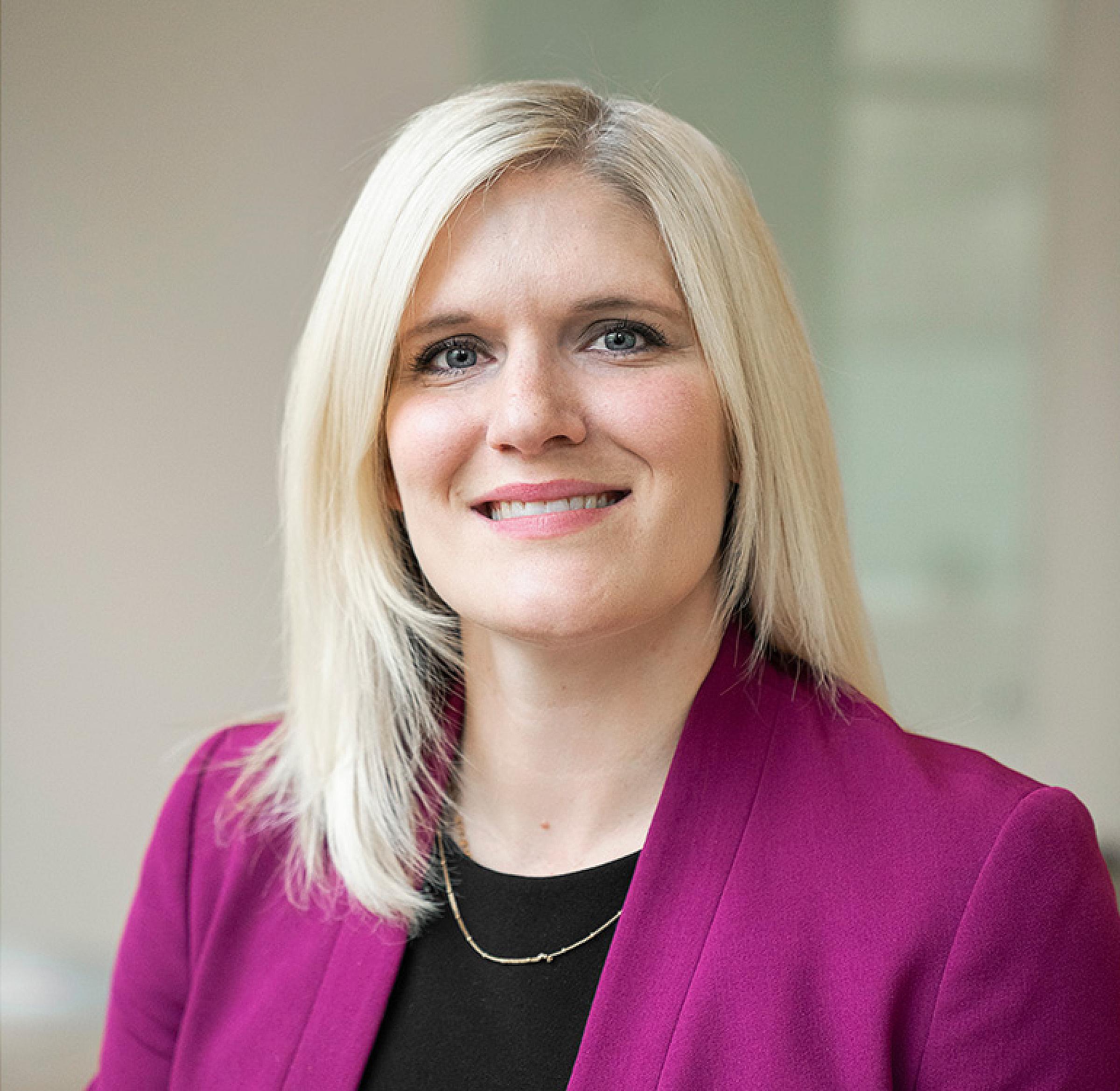 Ashlee Harrison in purple blazer portrait