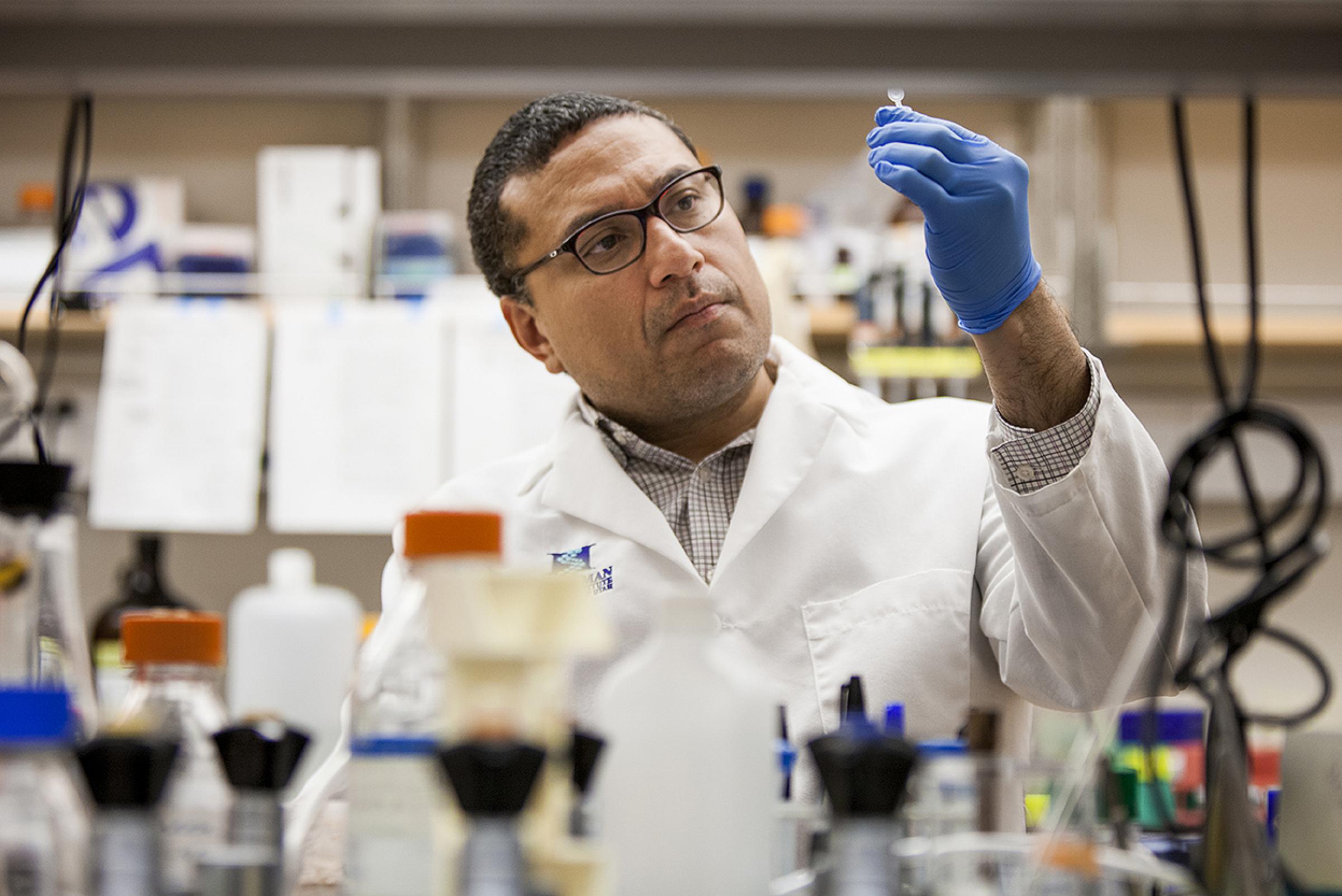 Samuel Cheshier, MD, PhD working in a lab