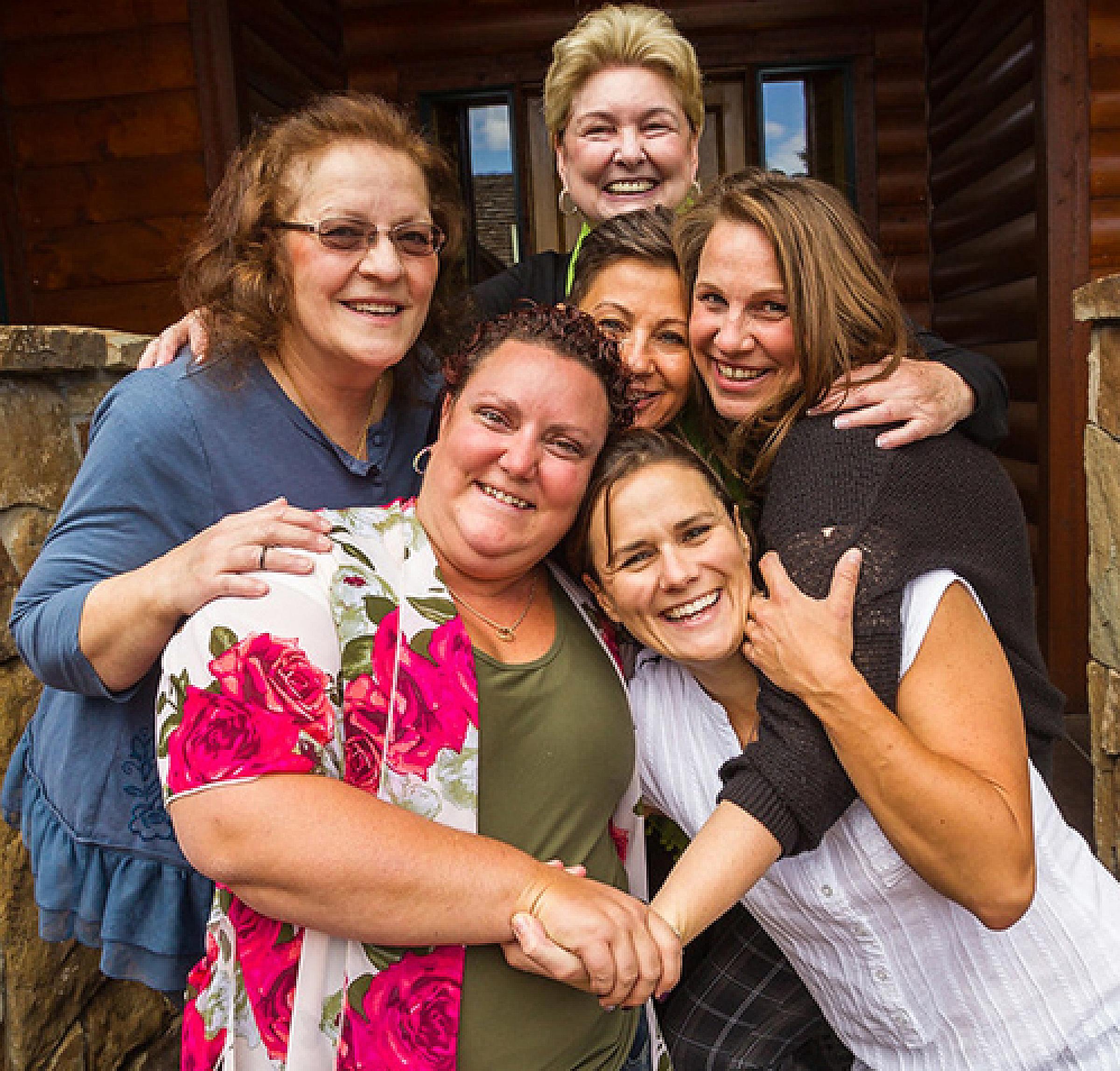 Image Reborn retreat participants hug