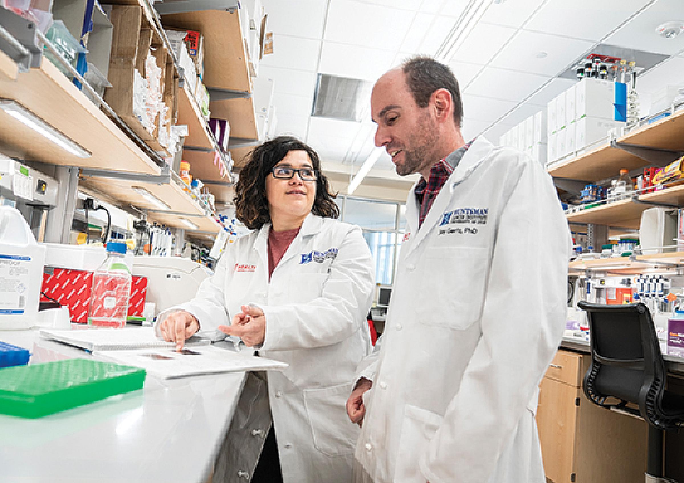 Adriana Rodriguez and Jay Gertz in research lab