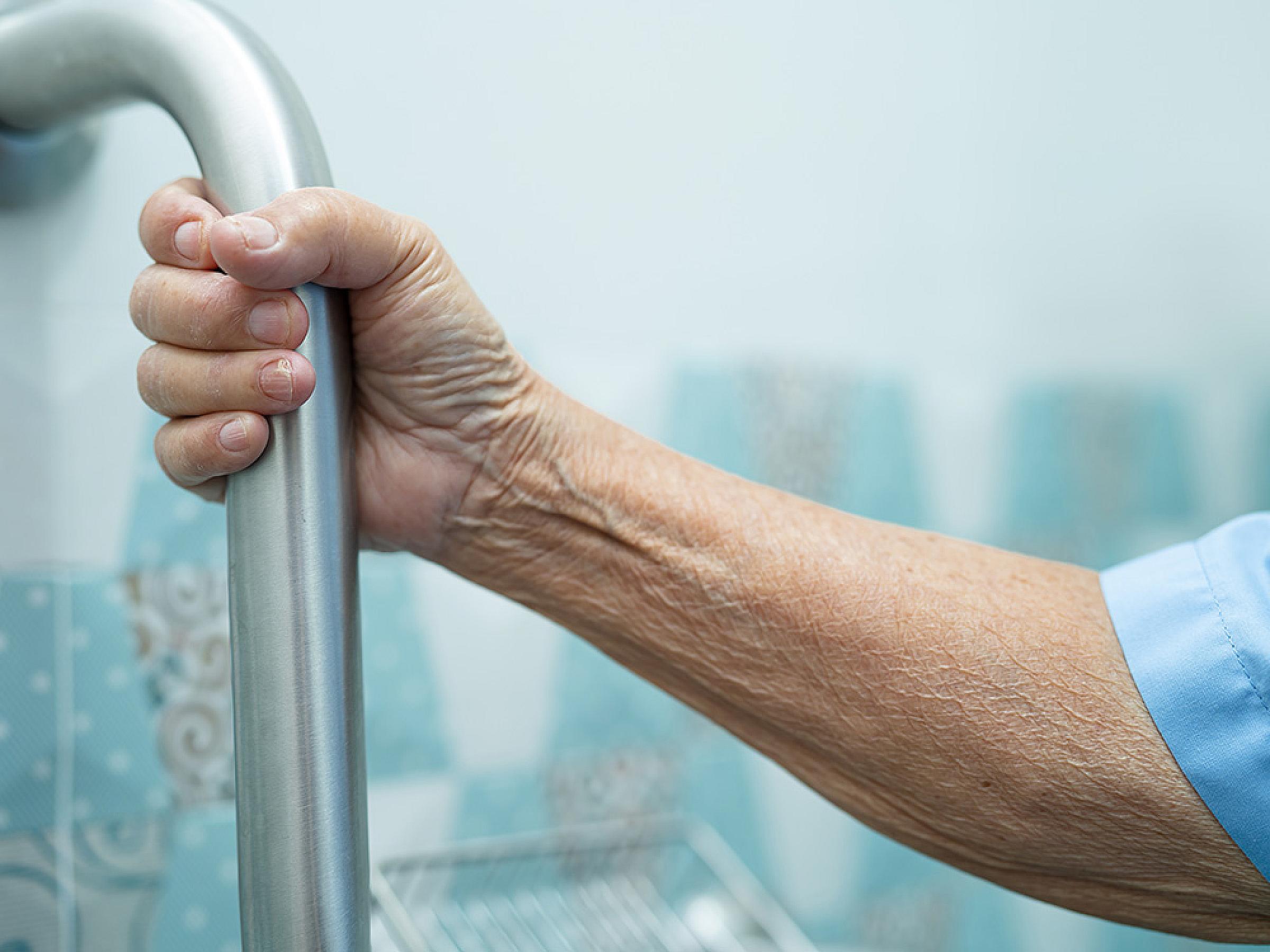 Human arm clutching safety railing