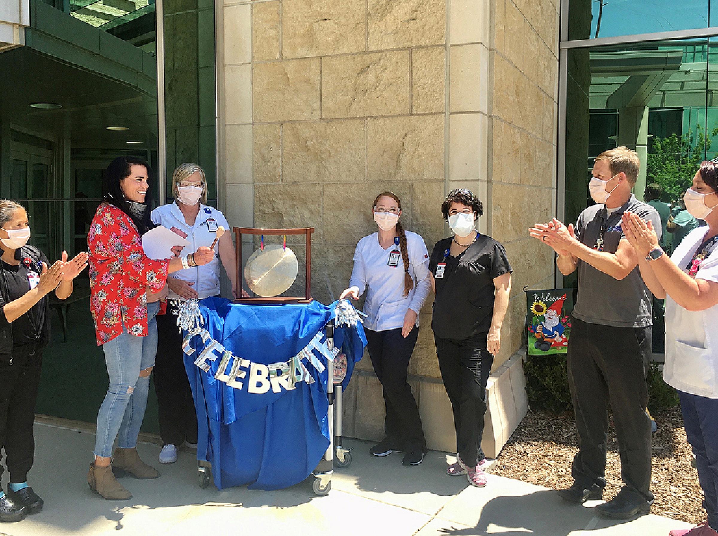 Rikki Morales Rings Celebration Gong Outside