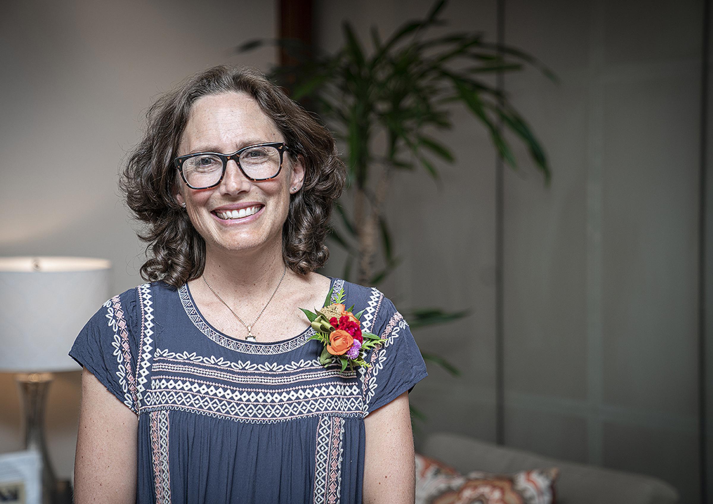 Ruth Centurier-Harris in blue blouse and corsage
