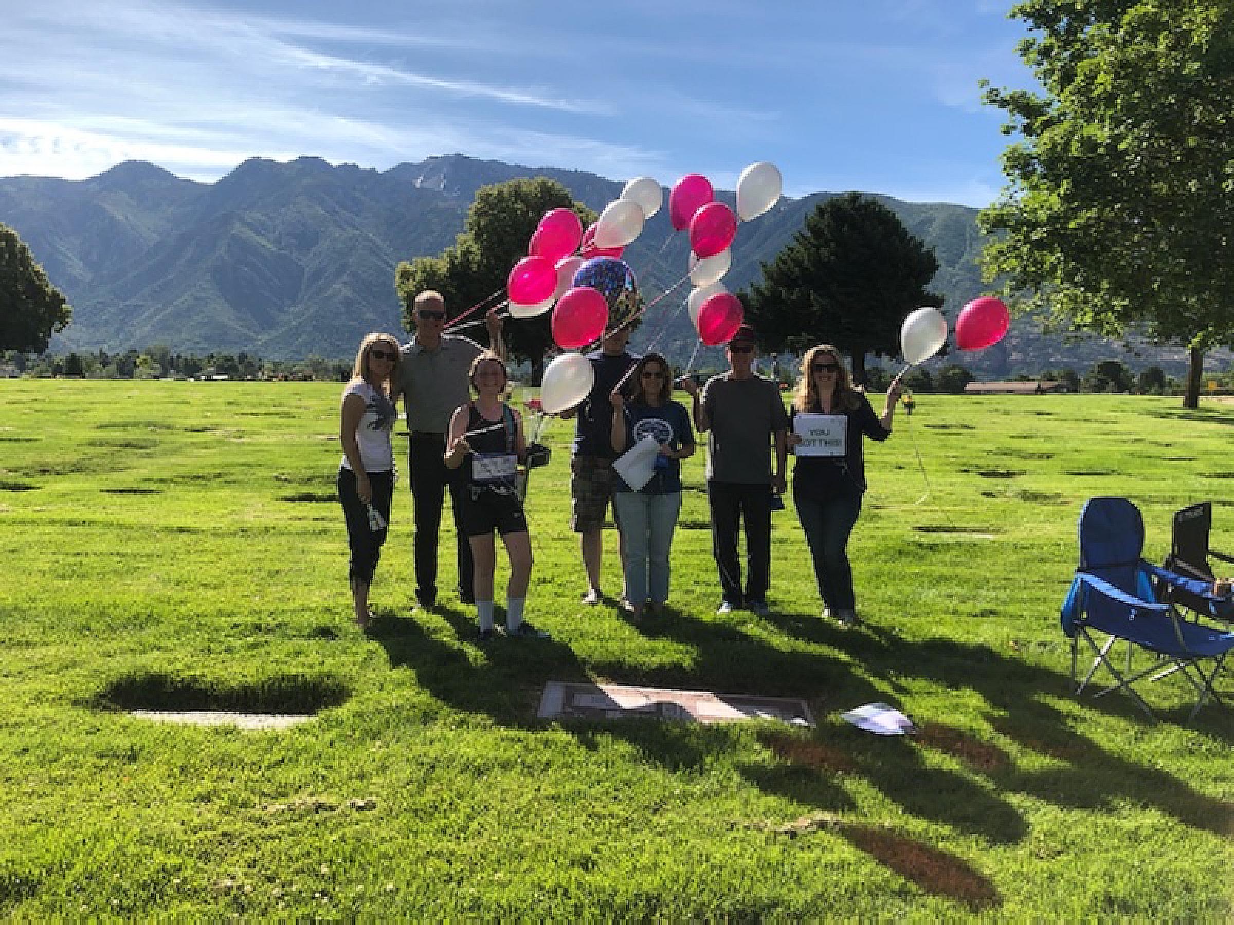 Allee Curby and Her Family Outside at the Cemetery