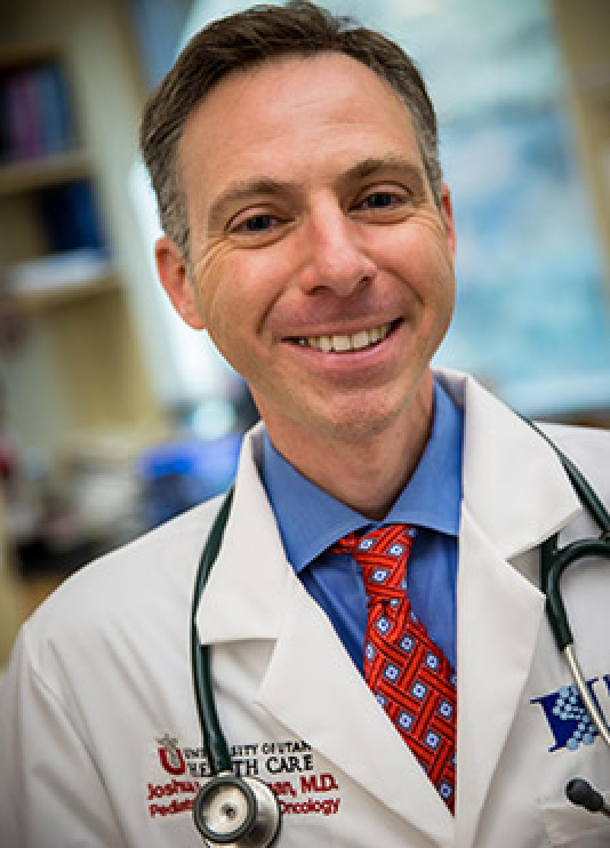 Joshua Schiffman in lab coat