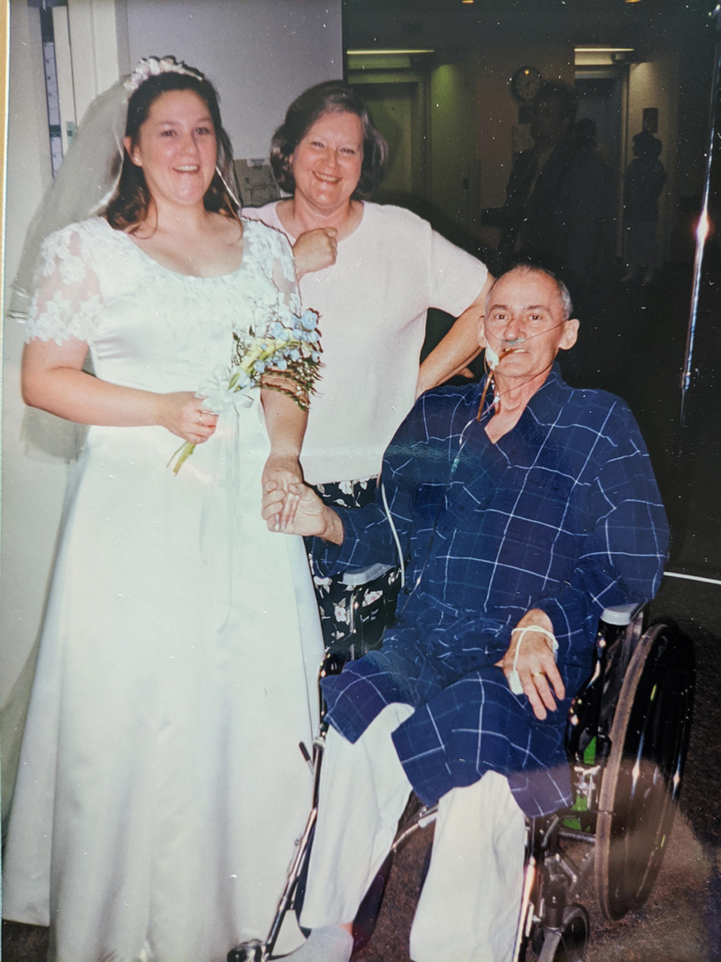 Karen Jensen with her parents on her wedding day