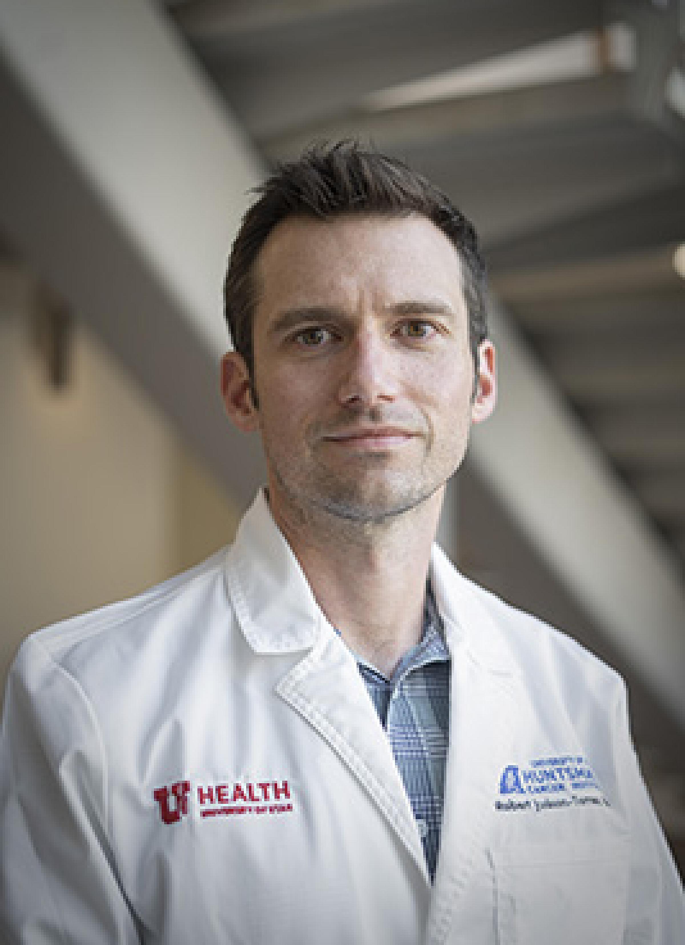 Robert Judson-Torres in lab coat, 2021