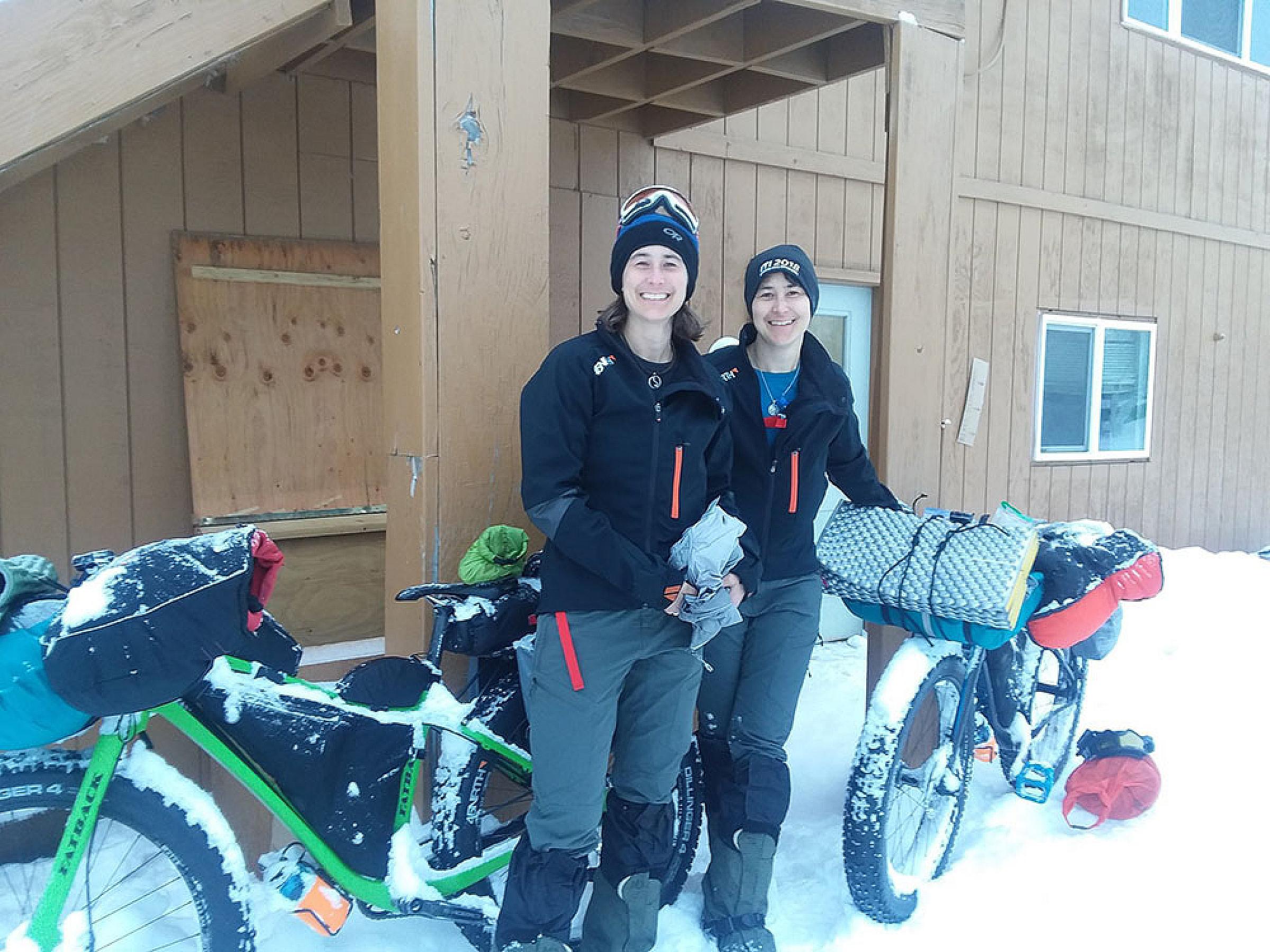 Jen and Melissa Diederich with their bikes in the snow