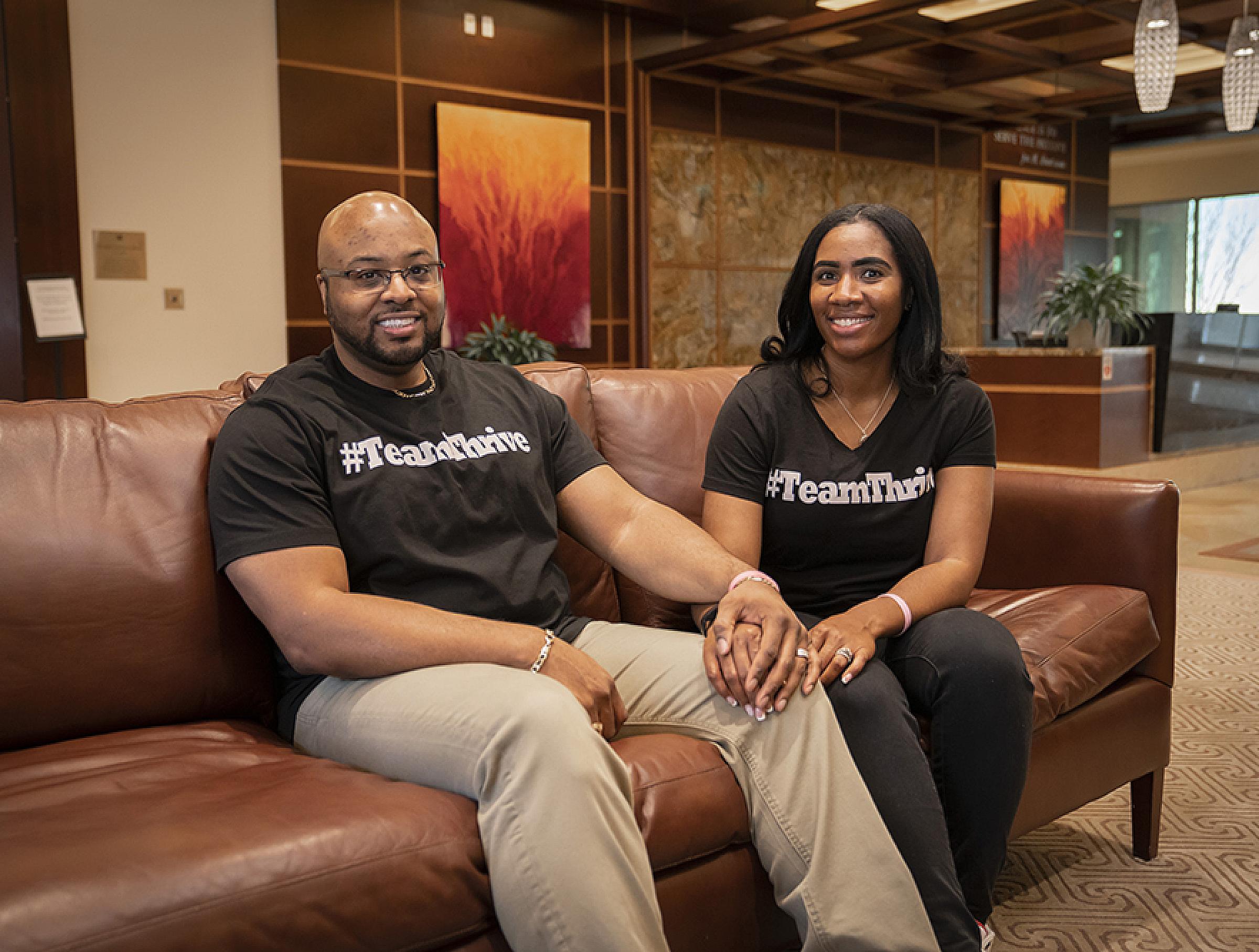 Tiana and Charles Rogers Sitting Together on Couch