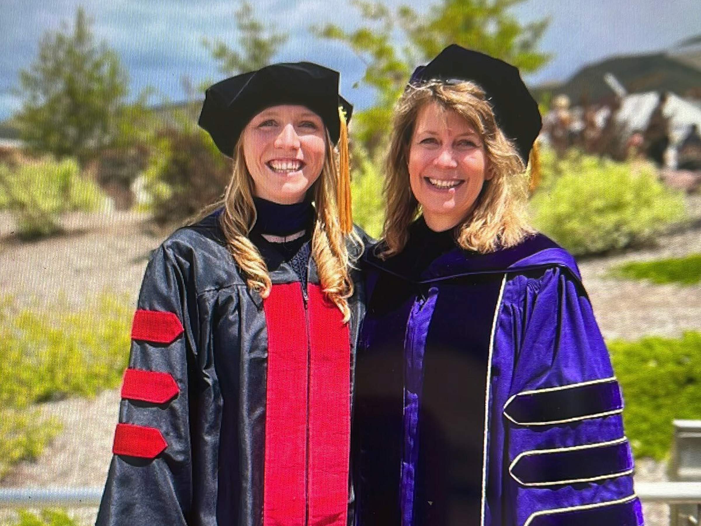 Caroline Himbert in cap and gown with her mentor, Dr. Neli Ulrich, PhD, MS