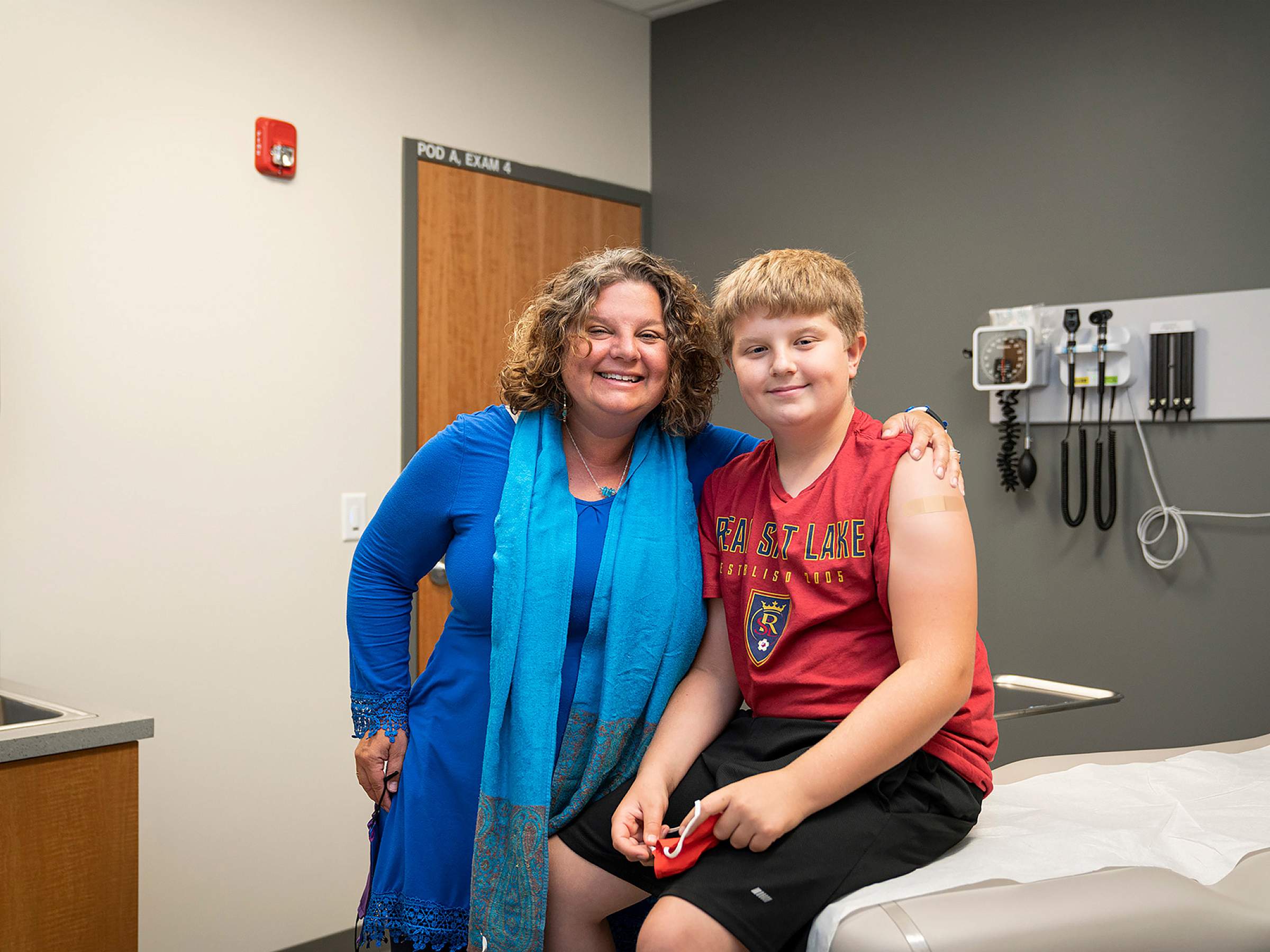 Deanna Kepka, PhD, MPH, and her son after taking him to get his HPV vaccine