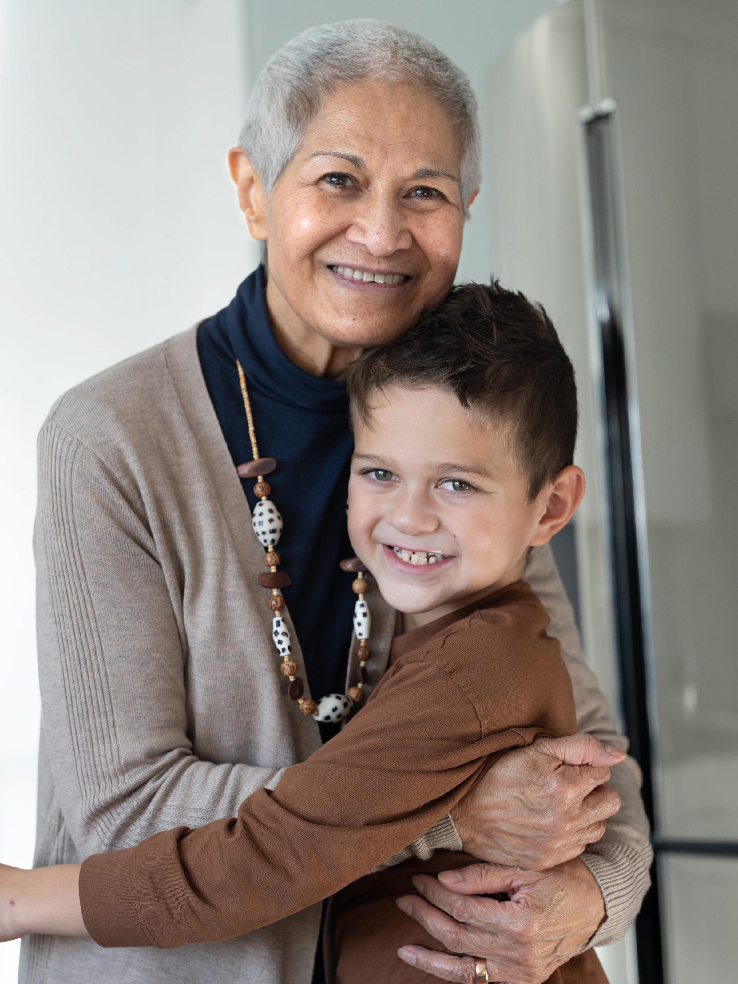 Jeanette gets a hug from her grandson, Ren. Photo Credit: Alvey Media