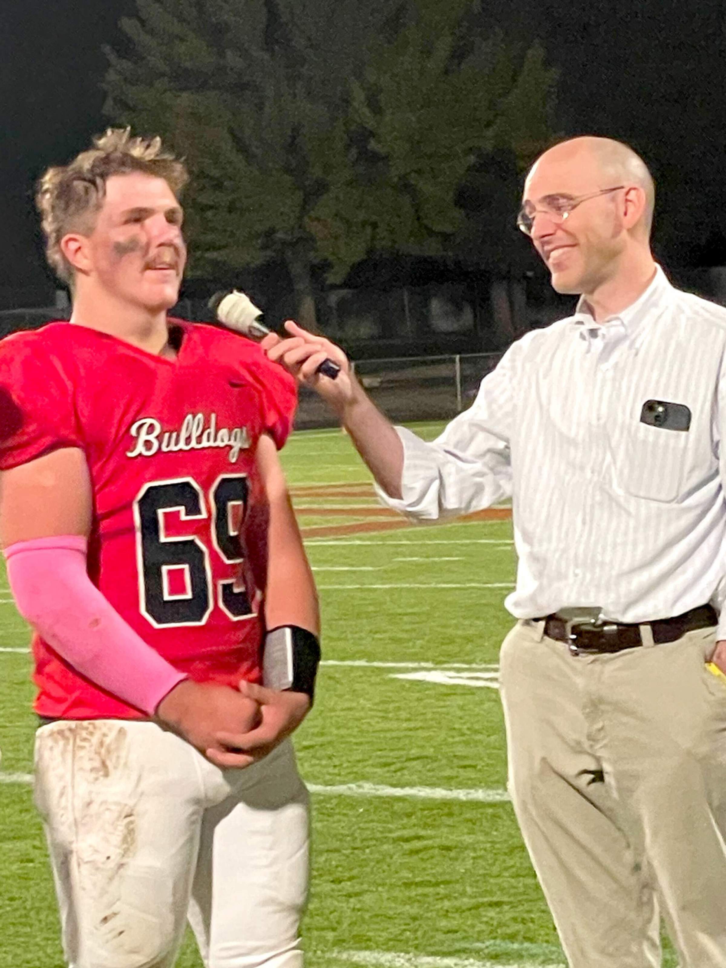 Gunner Stringham and Kevin Jones, PhD, at the senior night football game
