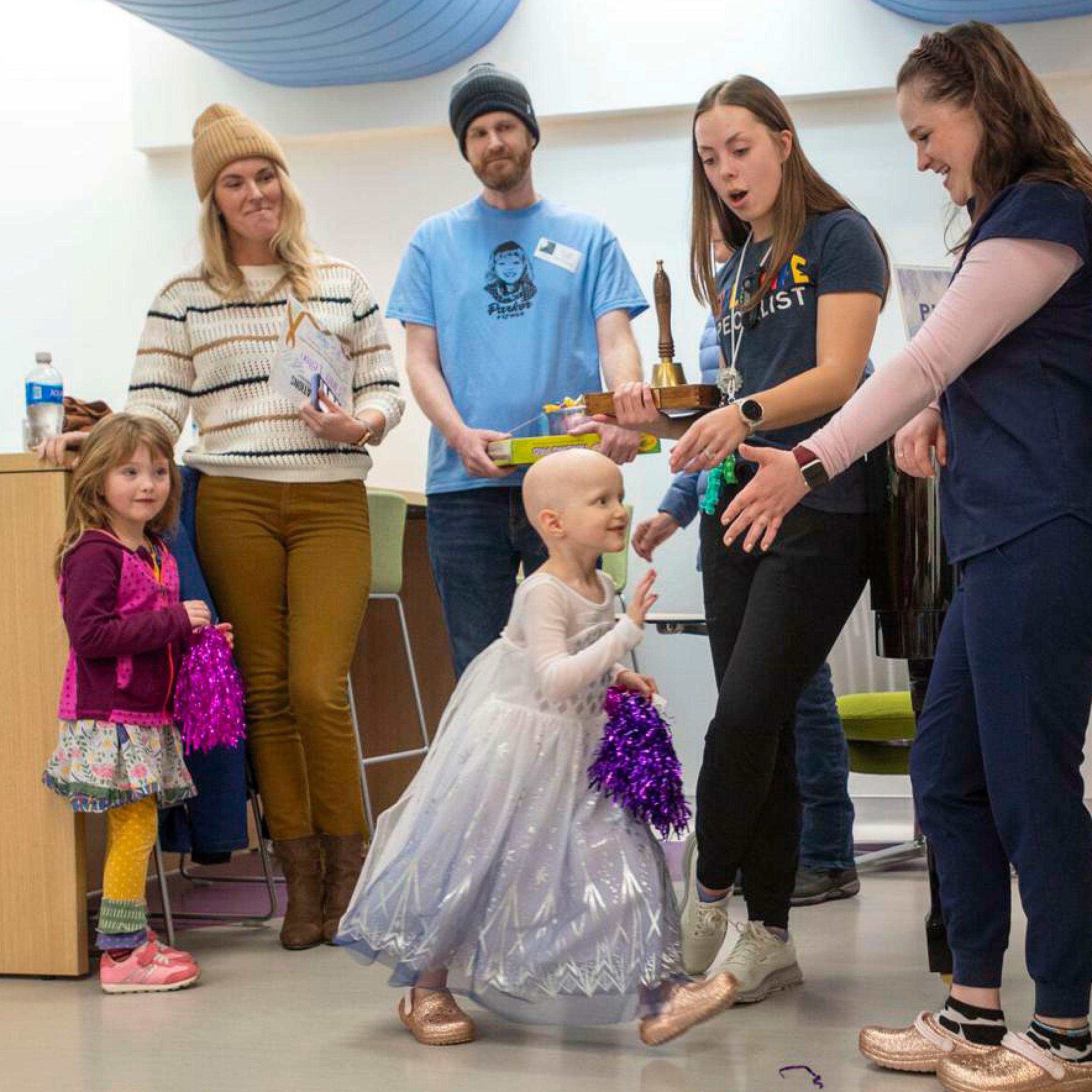 Parker giving her care team high fives
