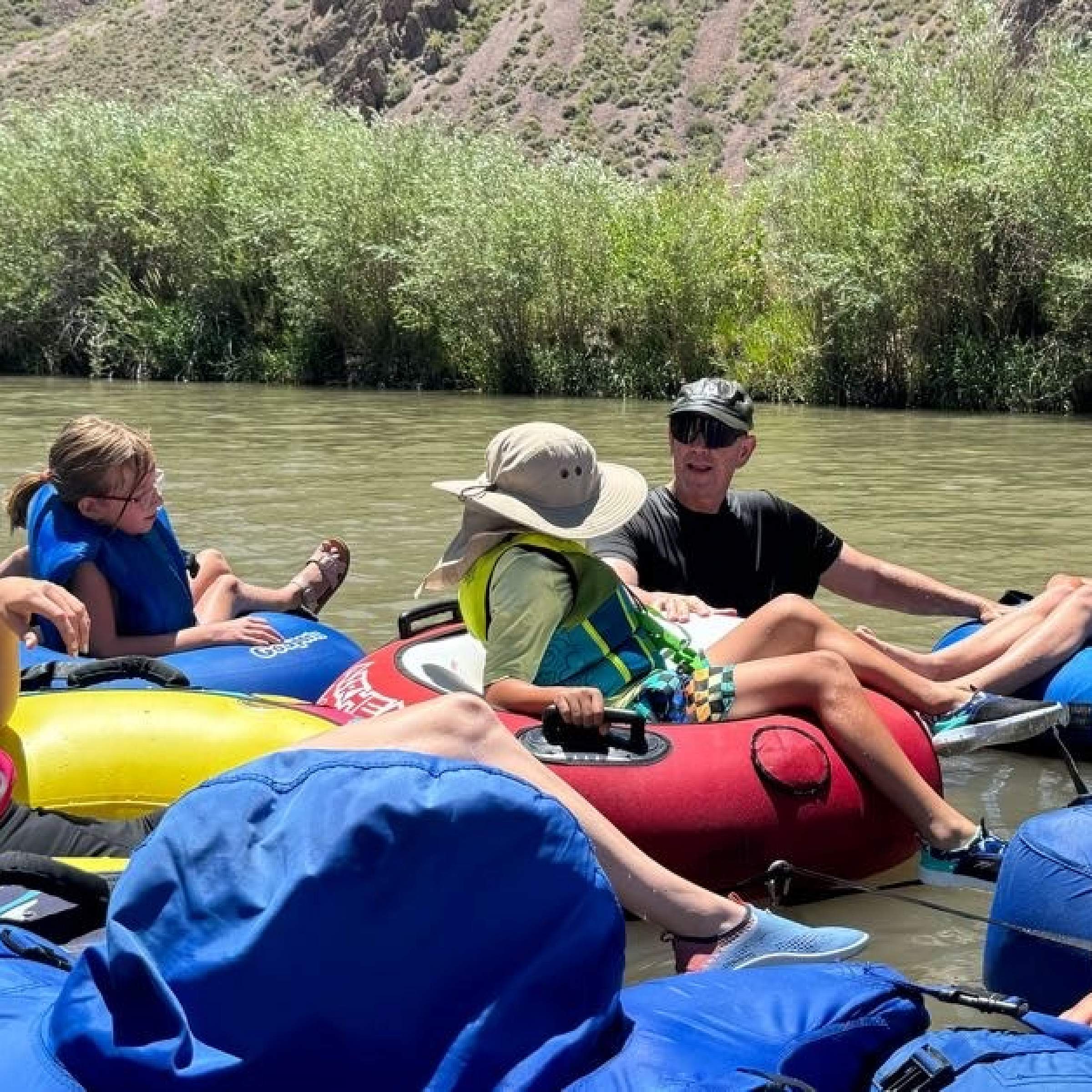 Dennis Freire tubing with his family