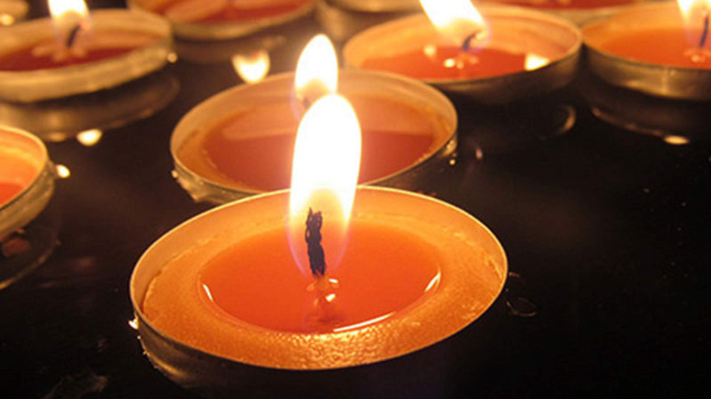 Rows of lit candles