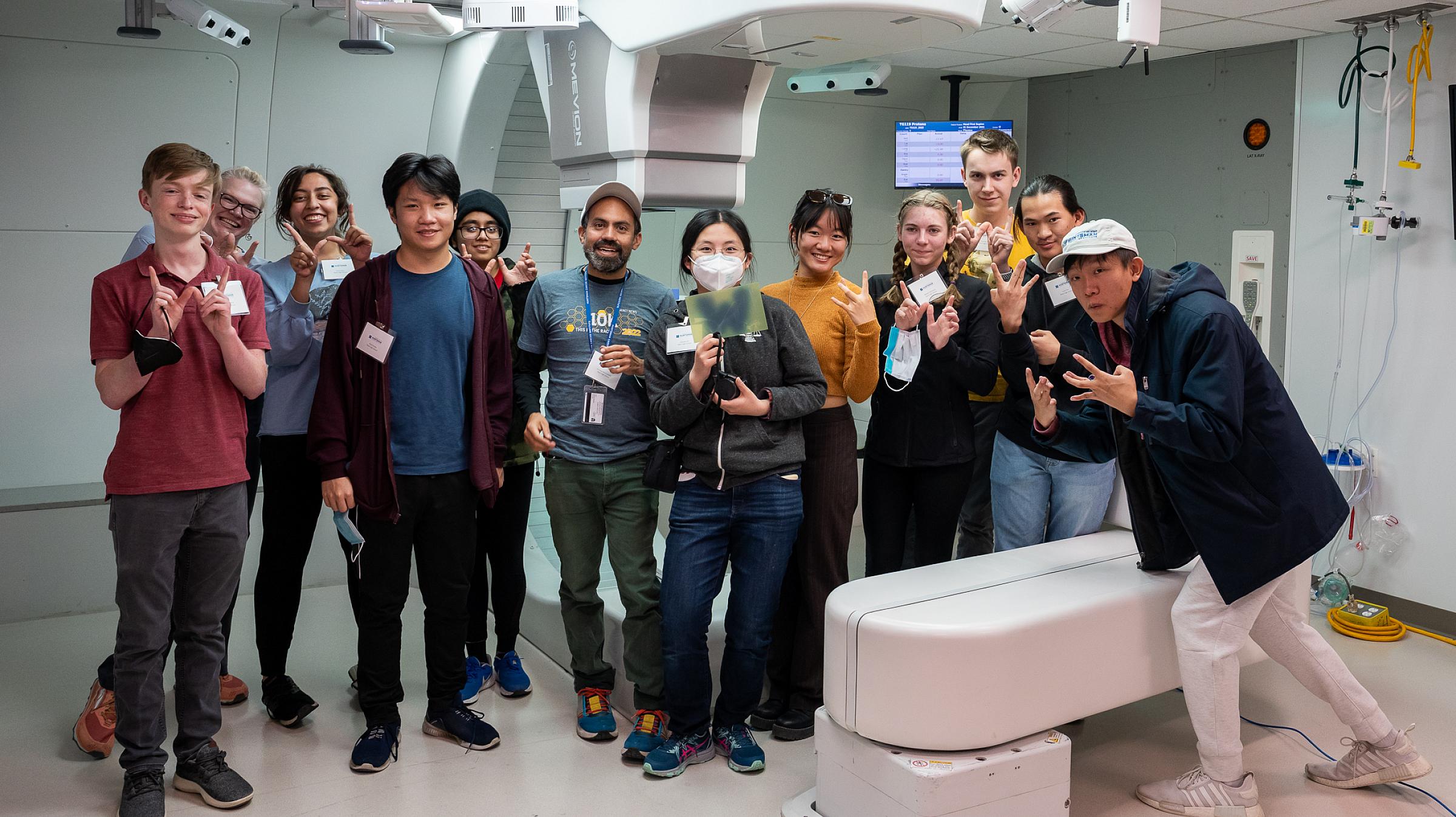 Enrique, sixth from left, with his West High School physics students on a 2022 tour of Huntsman Cancer Institute's proton therapy center.