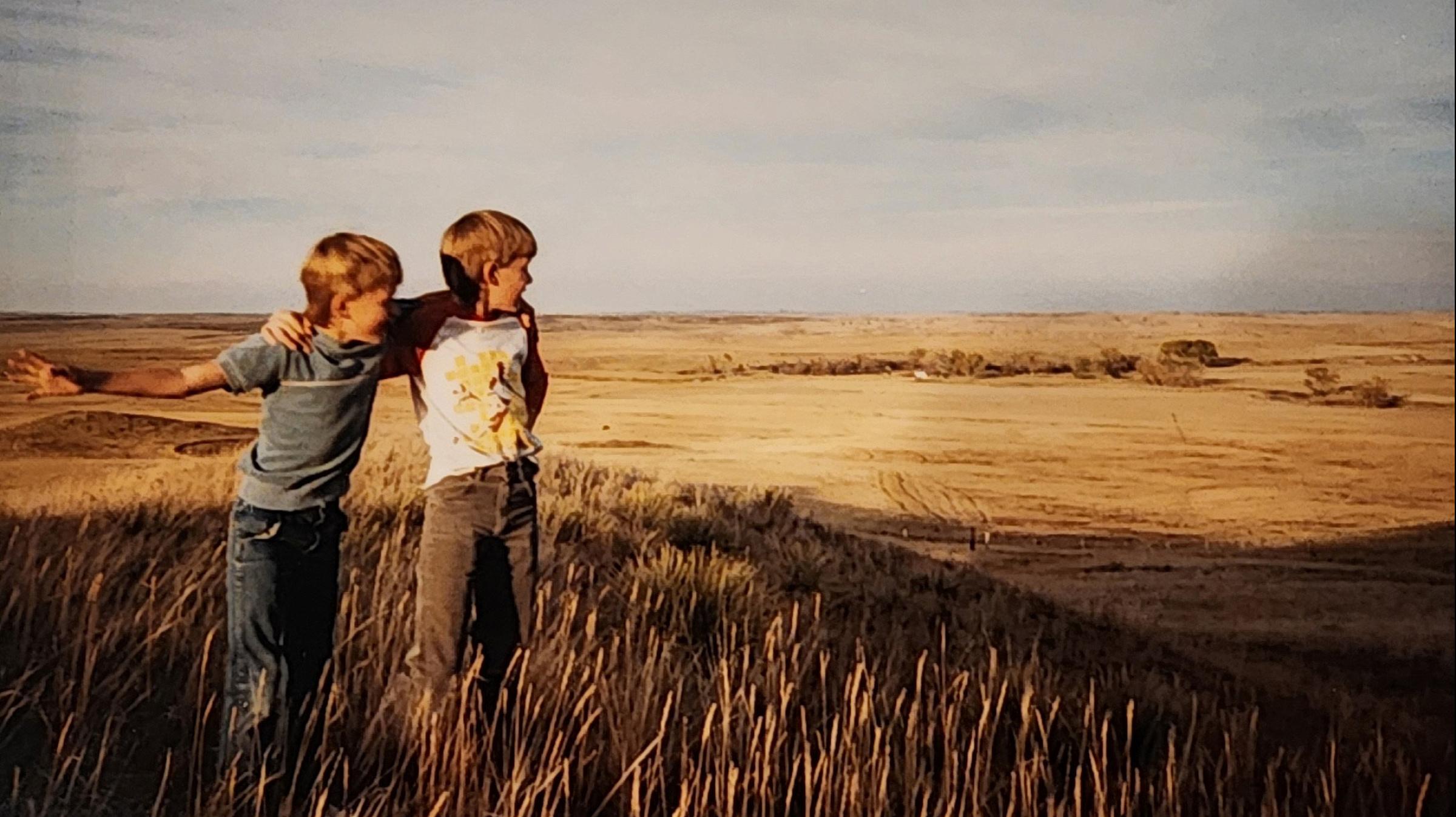 Jakob (left) and his brother, Judd, look out over the family farm.
