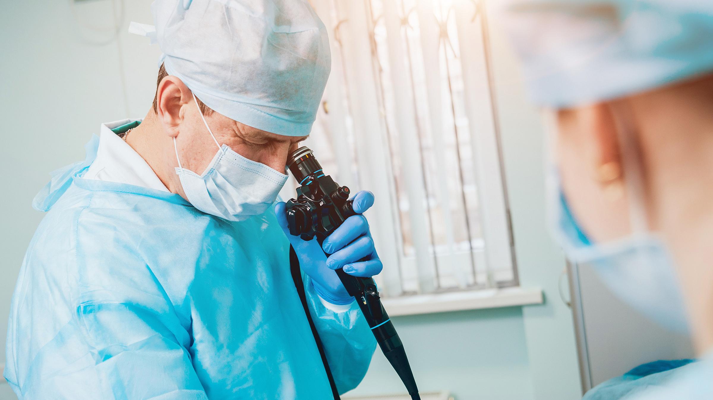 Doctor performing colonoscopy