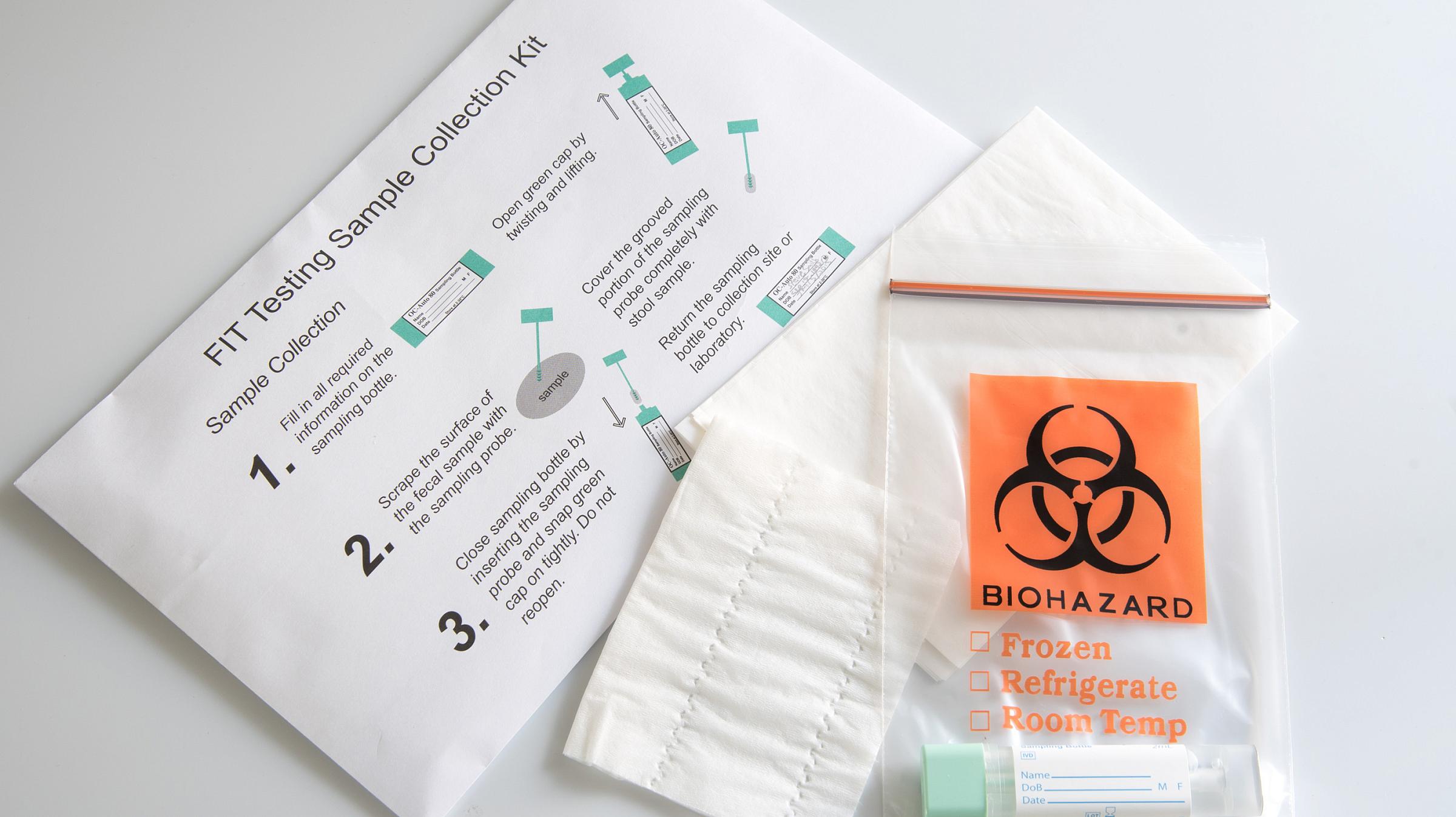 Fit test kit with instructions spread out on a table