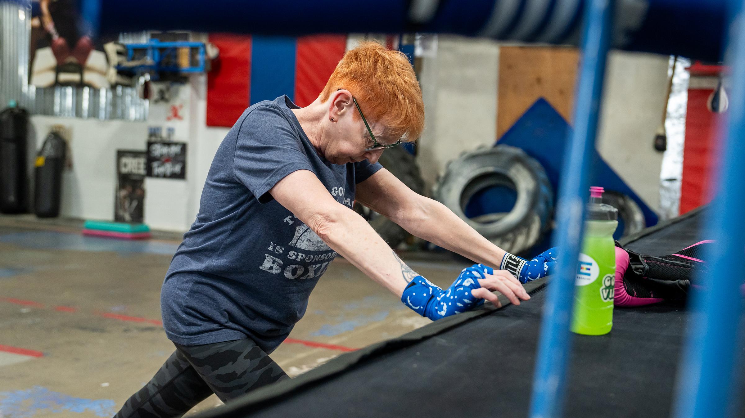 Diana stretching before a training session at Rocks Boxing in Rock Springs, Wyoming