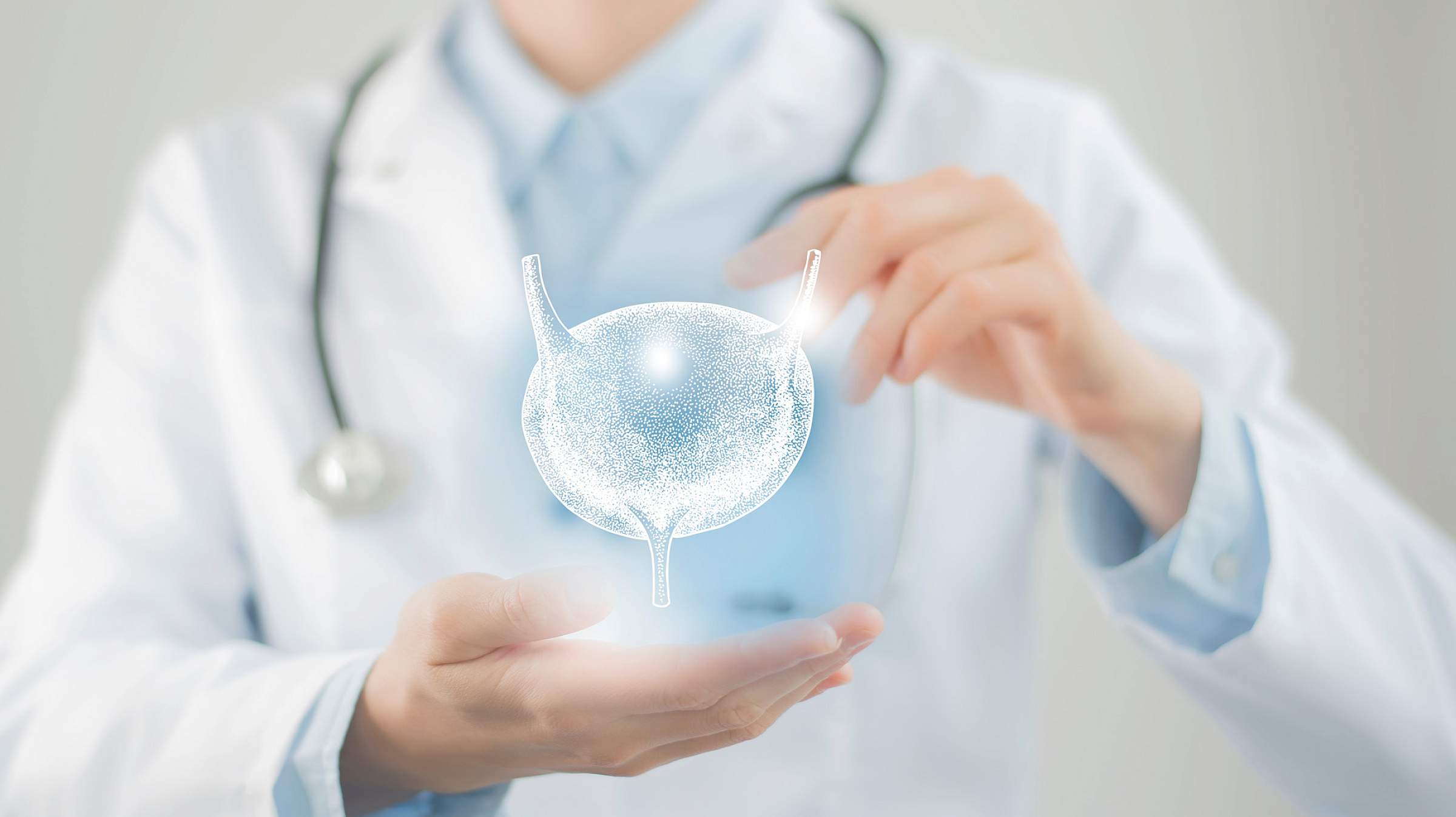 Doctor holding a glowing 3D image of a bladder