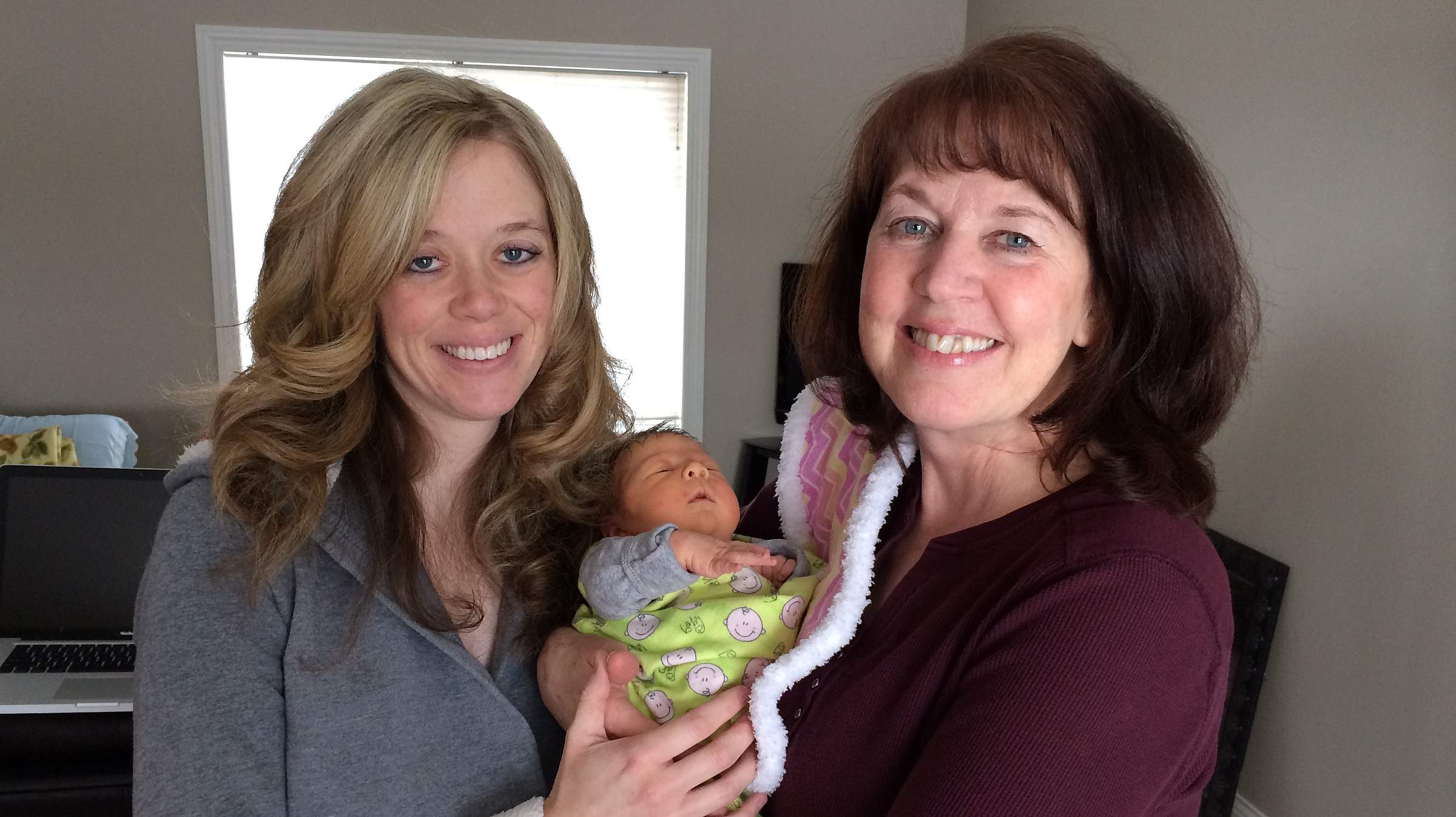 Charlene Edwards with her daughter and first grandchild.