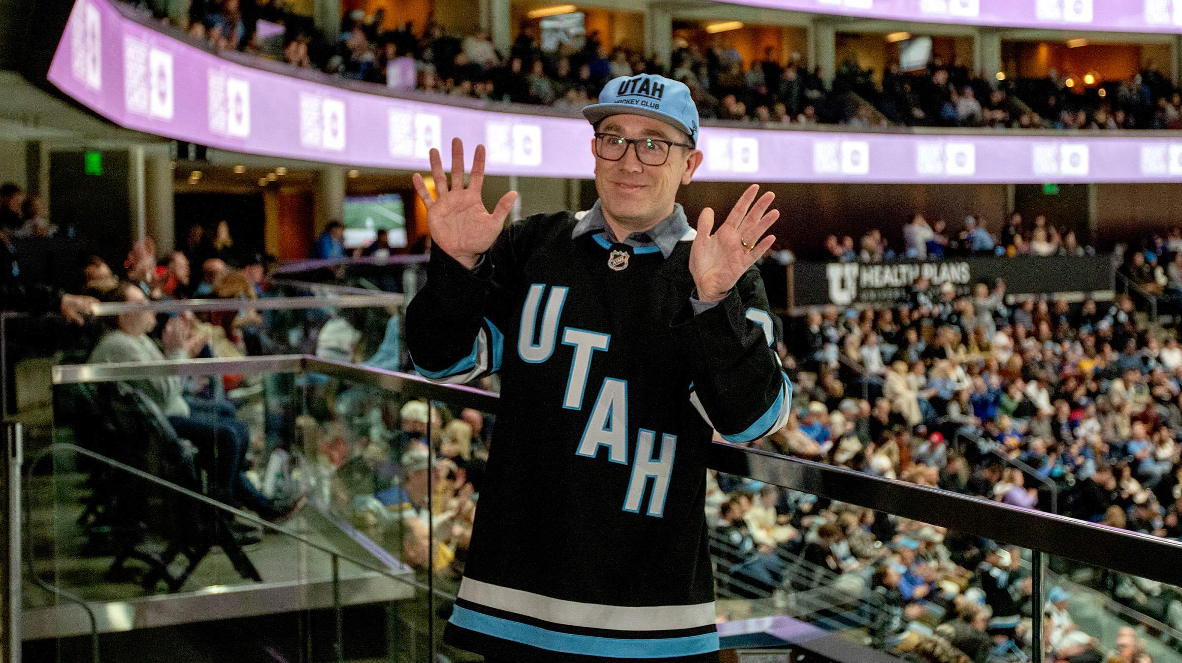 Brock O'Neil waves his hands at the camera during Hockey Fights Cancer Night