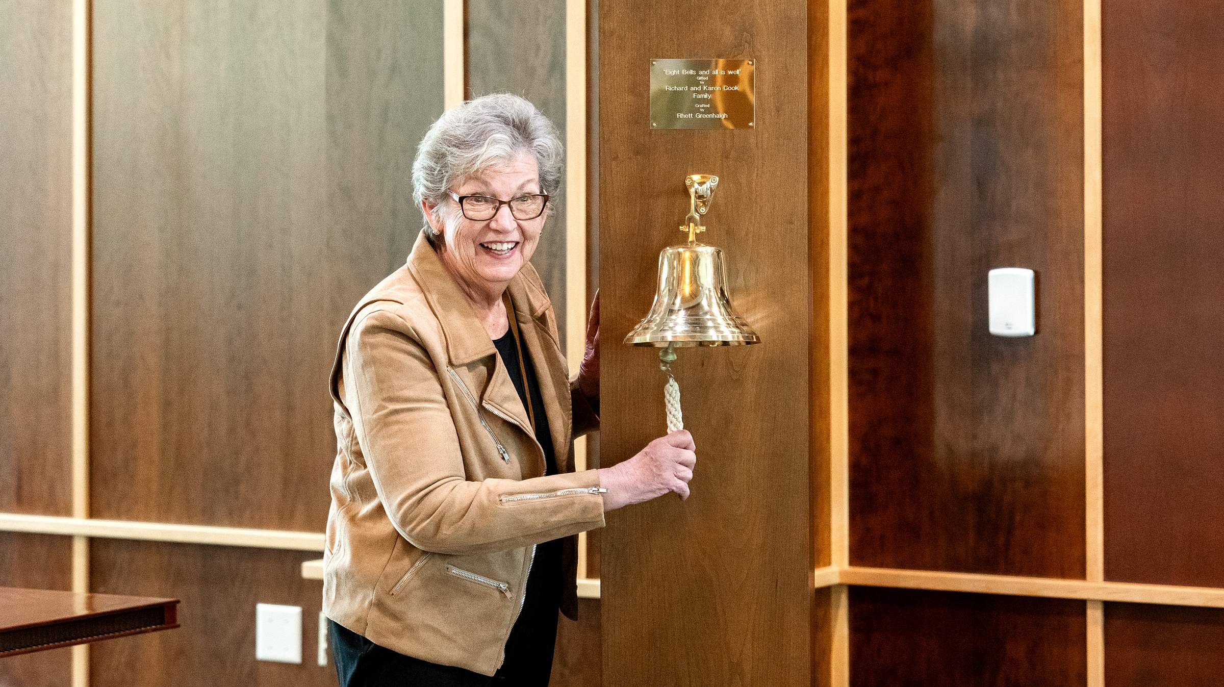 Karon ringing the bell she and her family donated