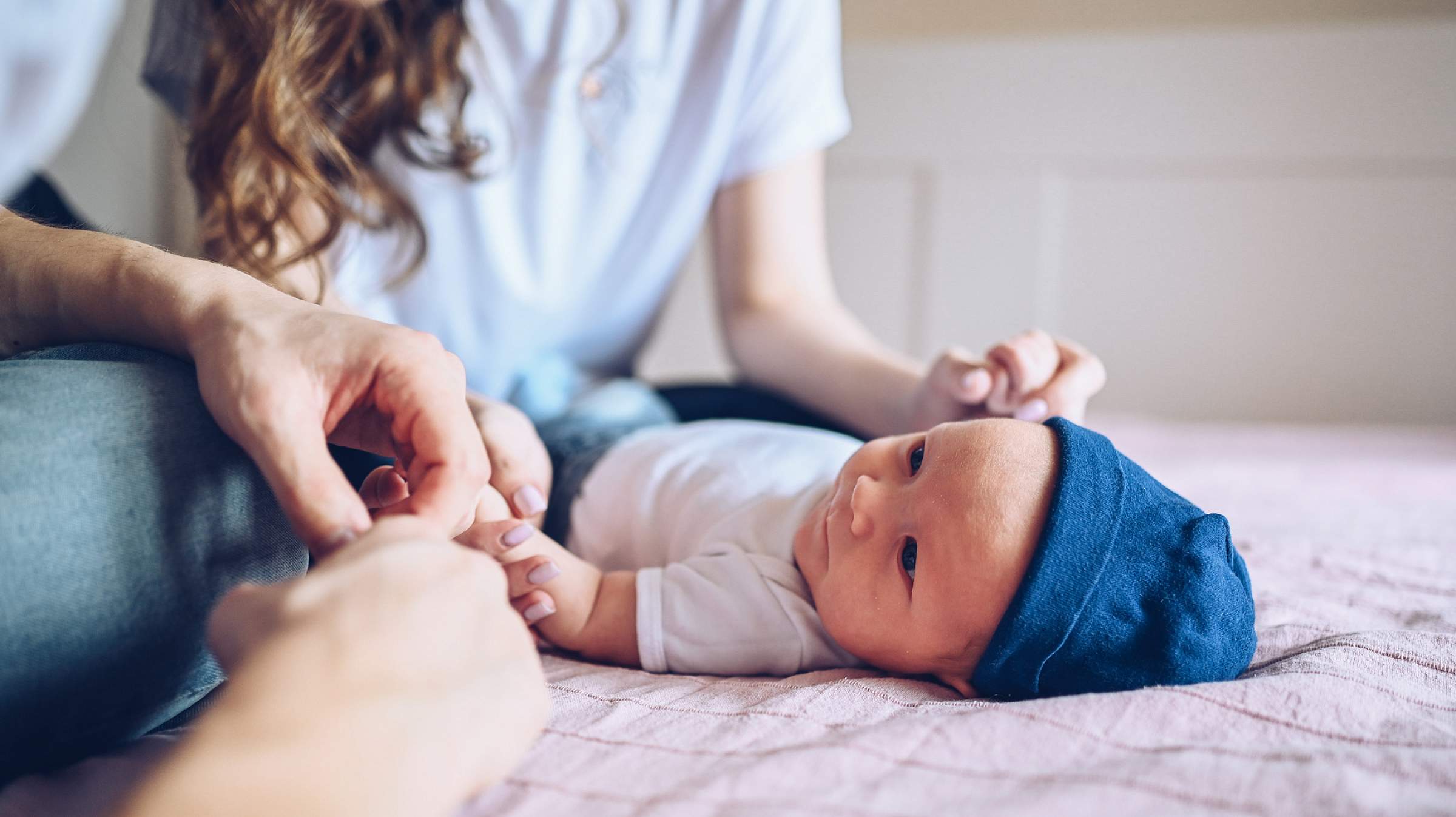 Parents playing with their baby