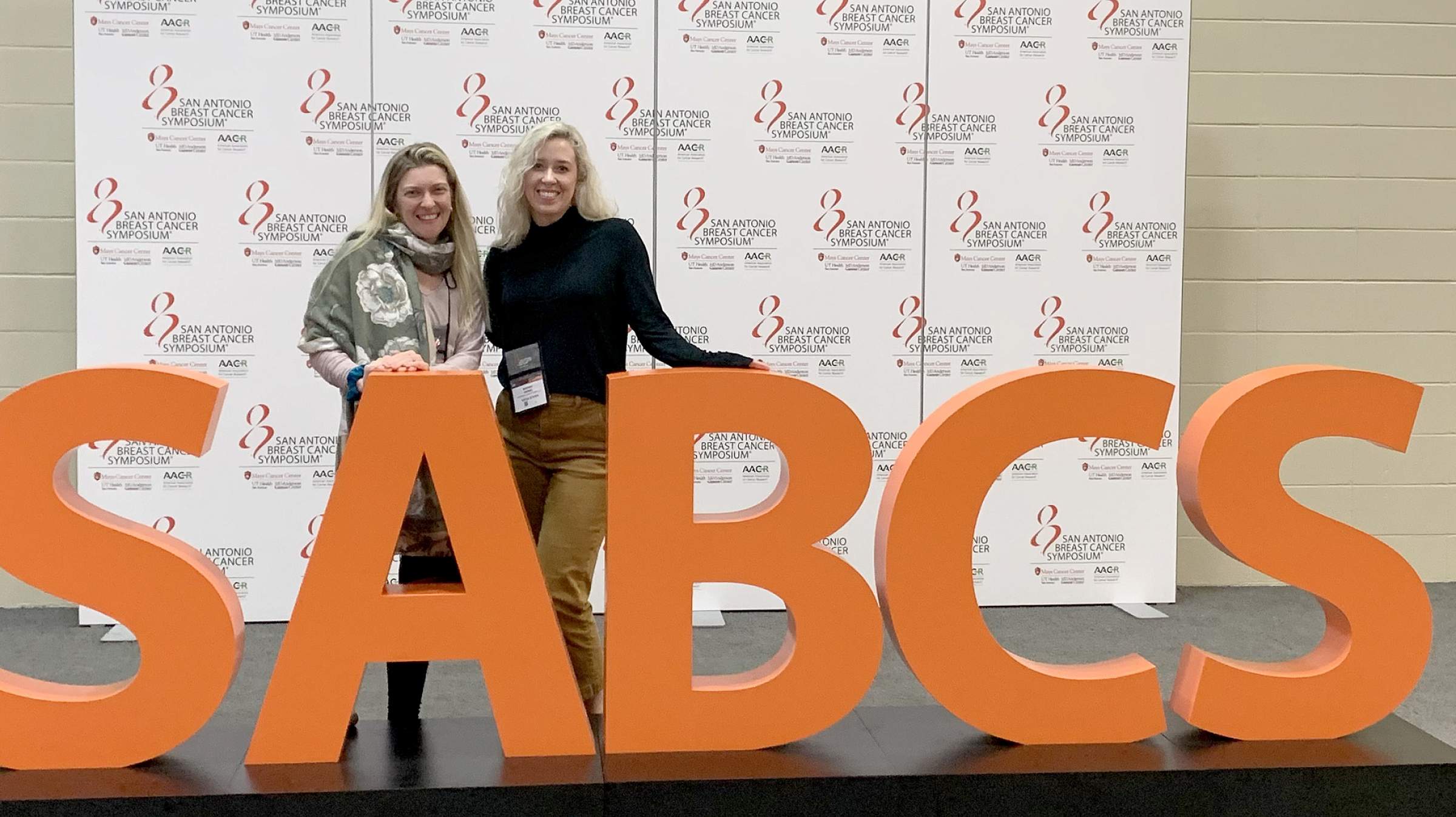 Whitney Maxwell (right) at the San Antonio Breast Cancer Symposium (SABCS)