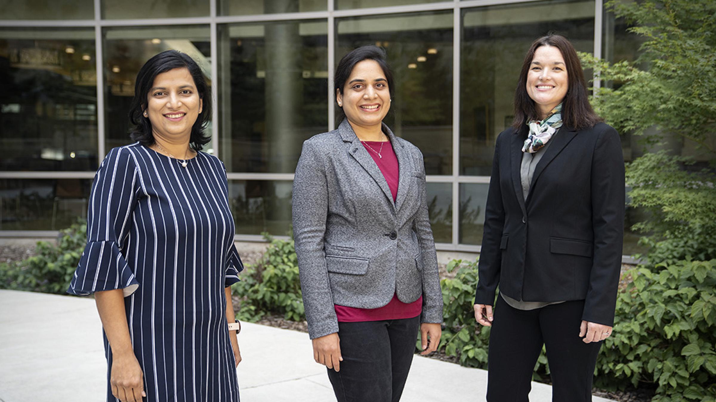 Sheetal Hardikar, Prasoona Karra, and Mary Playdon standing outside HCI