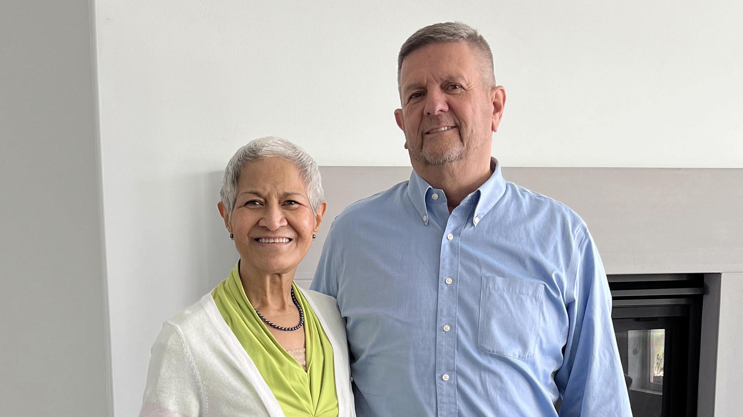 Jeanette and Doug Nielsen standing with their arms around each other