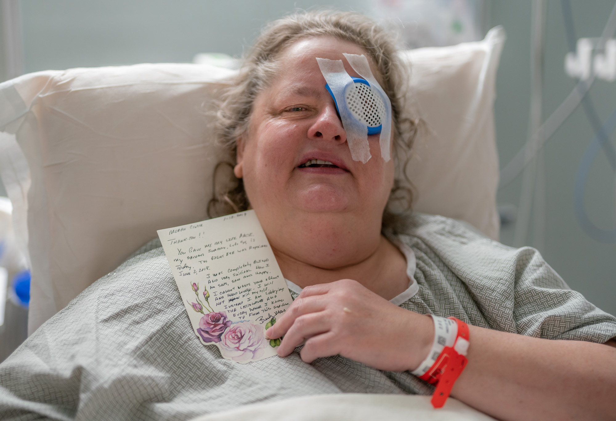 Becky Moss holds a thank-you note she wrote for the free cataract surgeries she received at Operation Sight Day events.