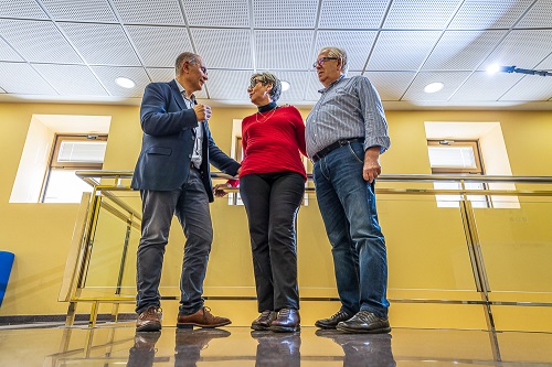 Professor Eduardo Fernandez, left, consults with Berna Gomez and her husband.