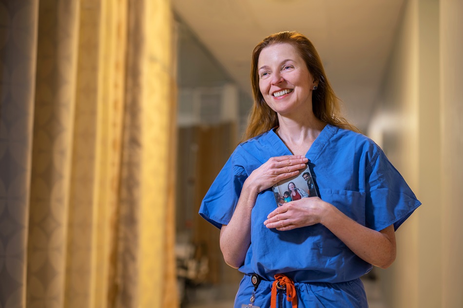 Mary Elizabeth Hartnett, MD, holds a favorite photo of Aidan and his family.